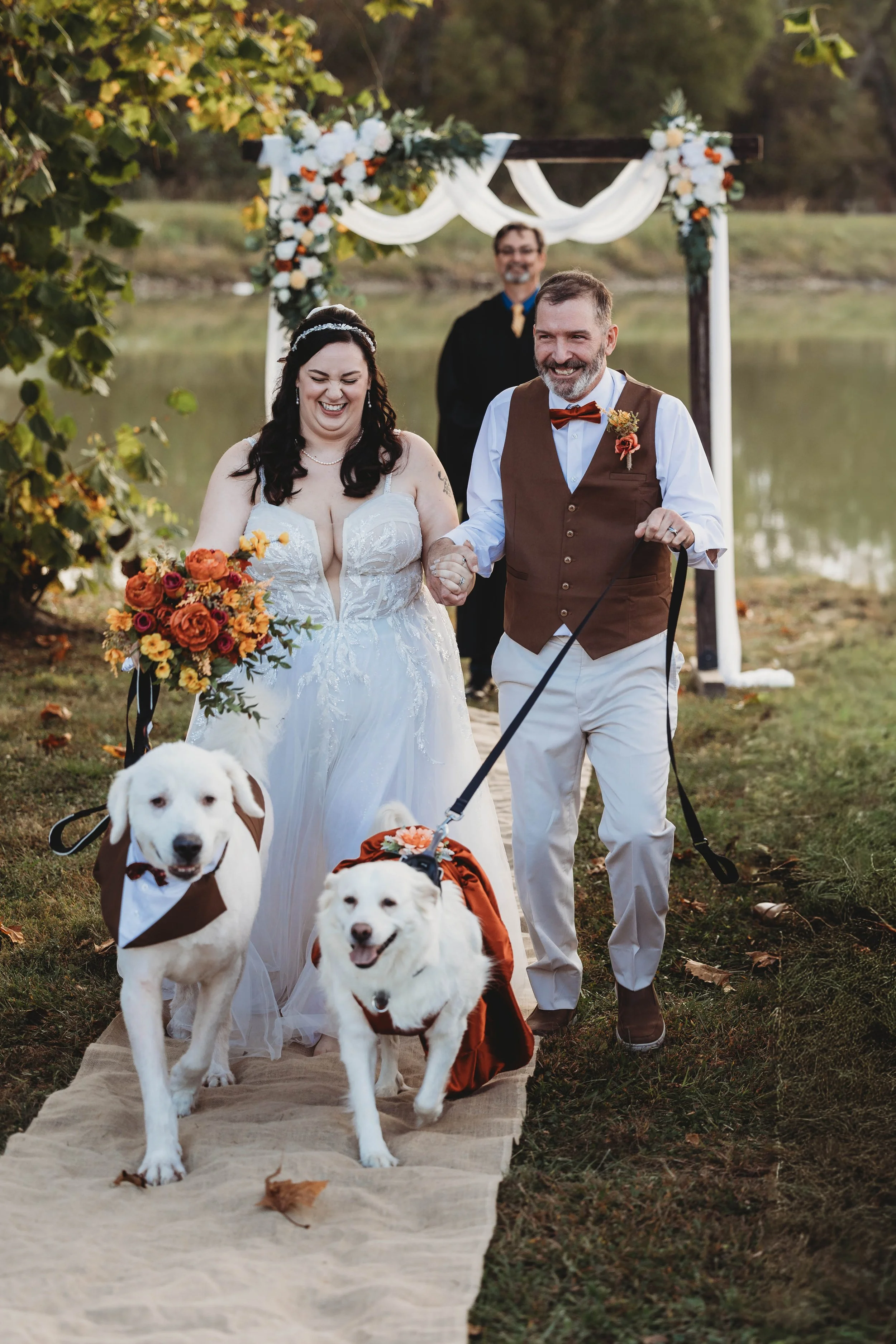 CapturedbyCairnsPhotography-Tori and Tim Wedding Recessional.jpg