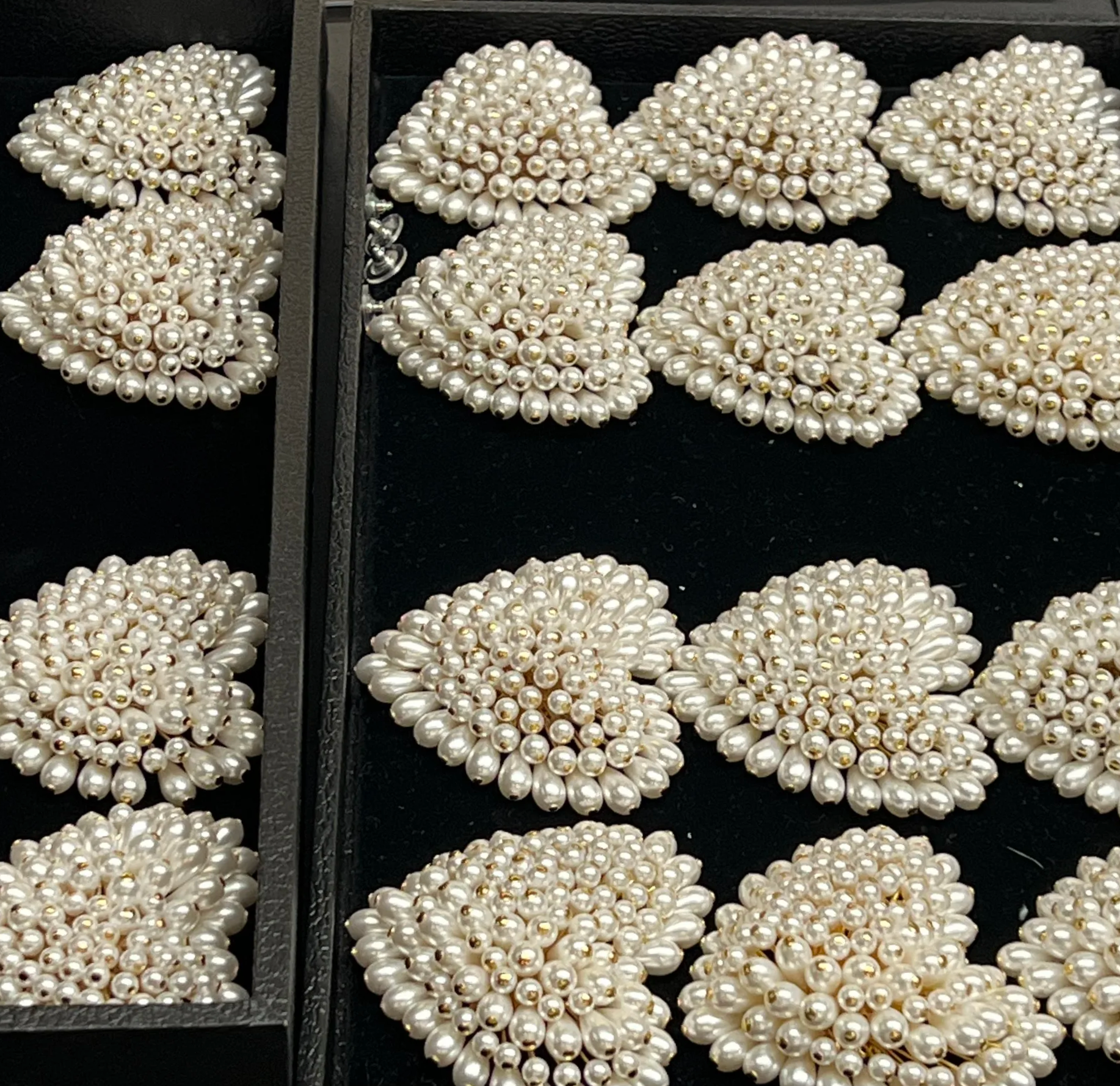 Worked with the entire team to hand-build pearl earrings, attaching each pearl head to metal rods to form the heart shape. Created the initial mockup before collaborating with the team on final production.