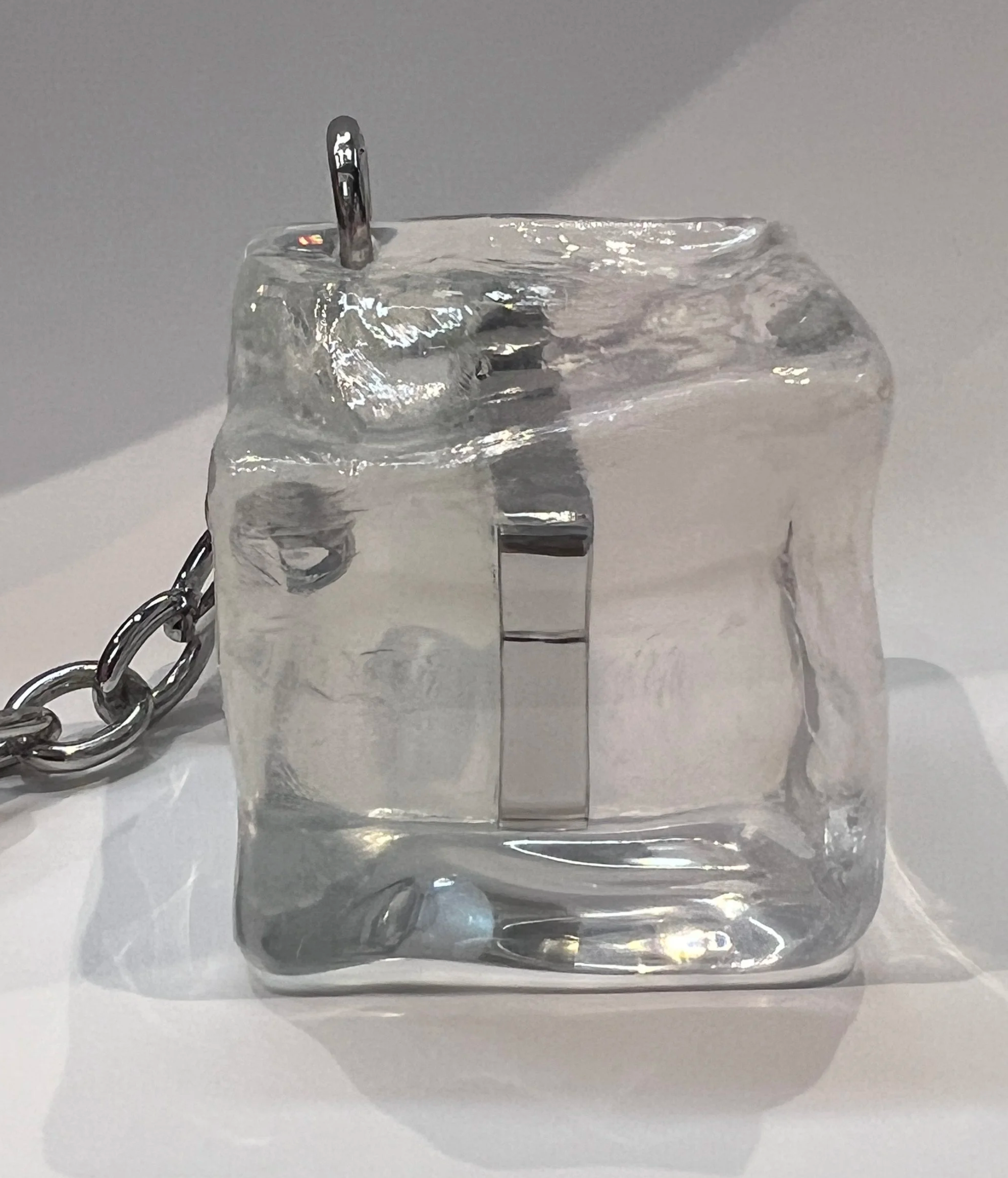 Drilled a resin ice cube to shape it into the desired form for production.