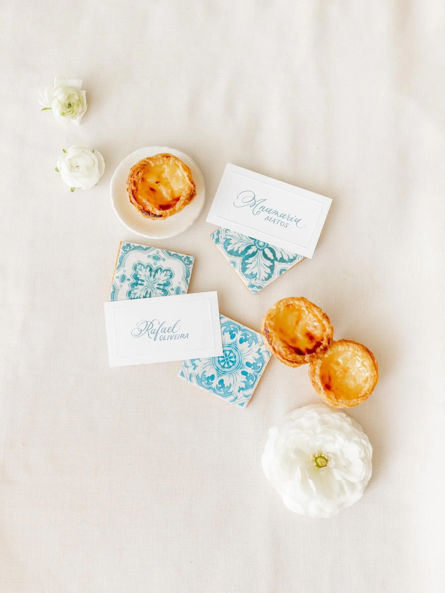 The details are where the story lives.

For this Portugal elopement editorial, every element was rooted in the culture and region &mdash; blue calligraphy place cards, a menu built around local dishes, and cookies hand-painted to mirror the iconic az