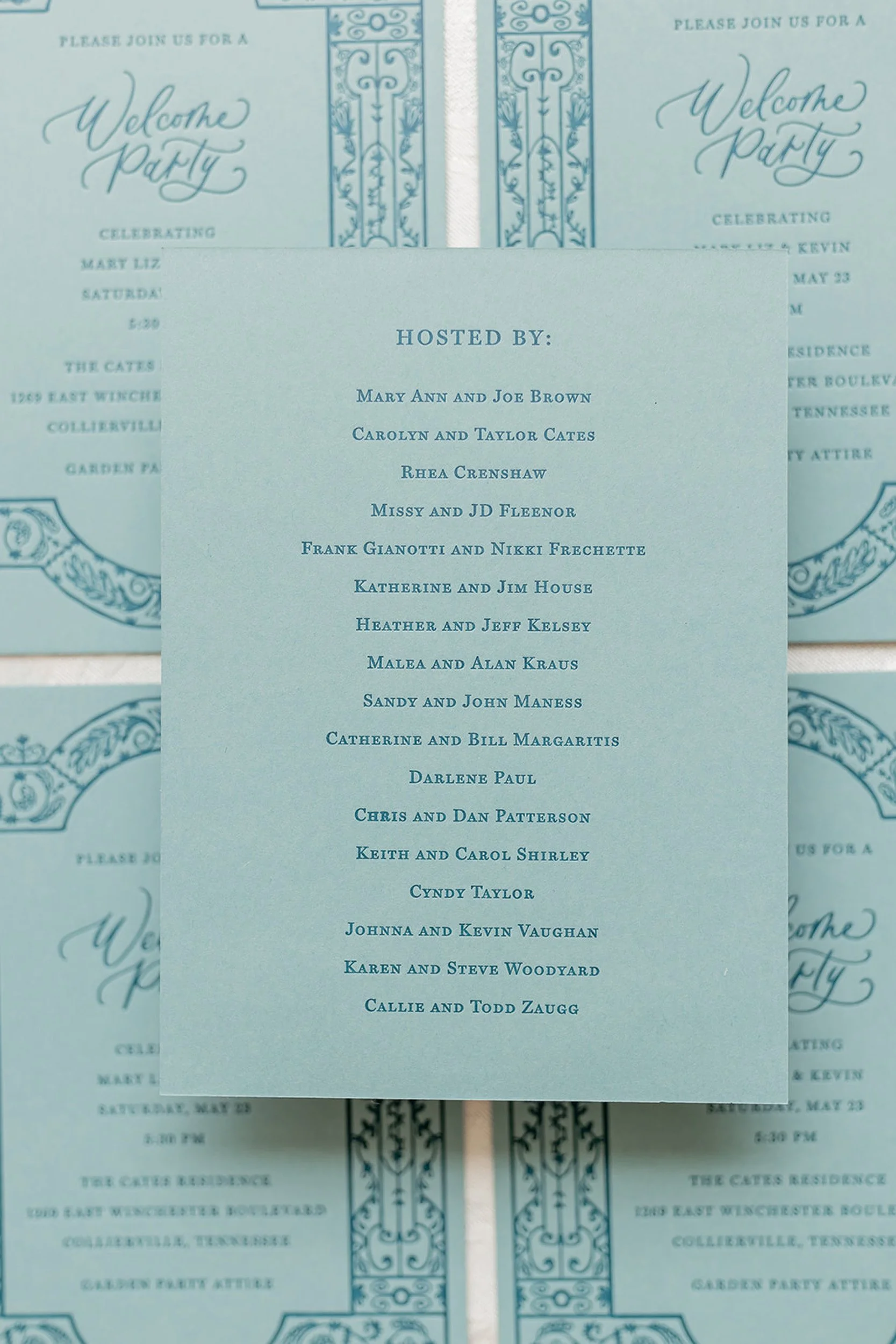 Invitation for a welcome party with details about the celebration, hosts, date, and location printed in elegant blue text on a light blue background, decorated with ornate border designs.