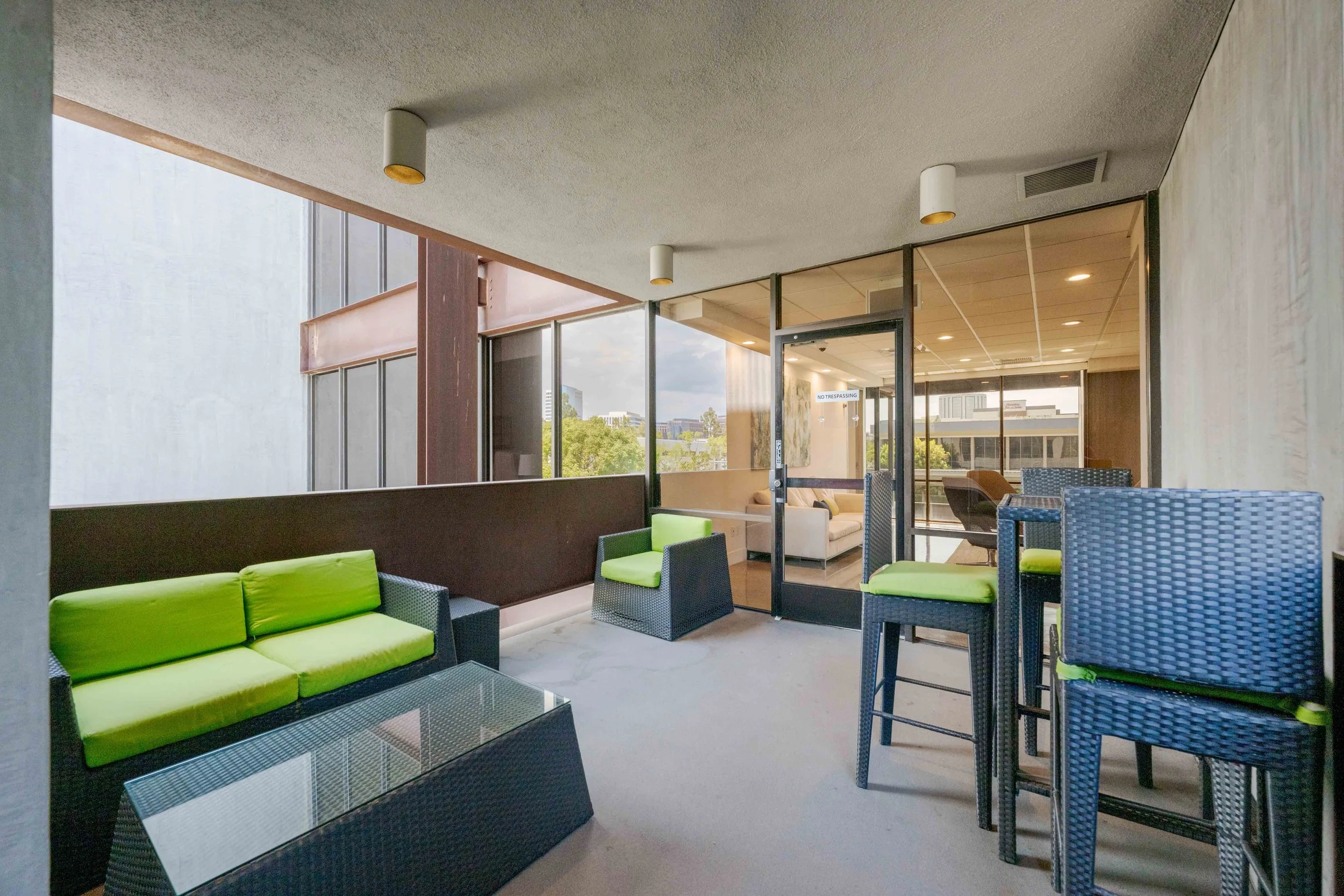 outdoor seating area with a balcony view