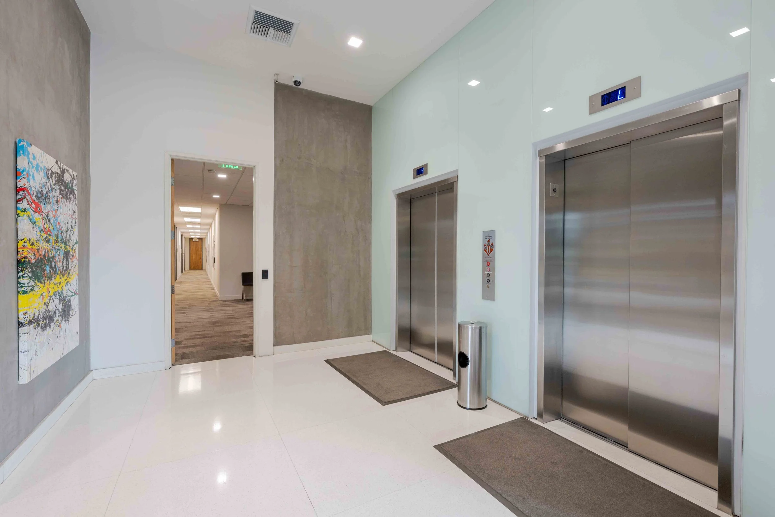 two sets of elevators in the main lobby