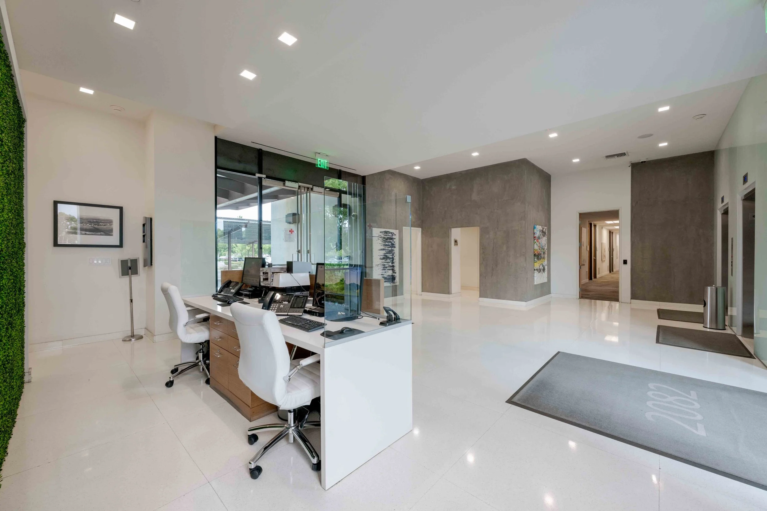 Lobby interior with a front desk and elevators