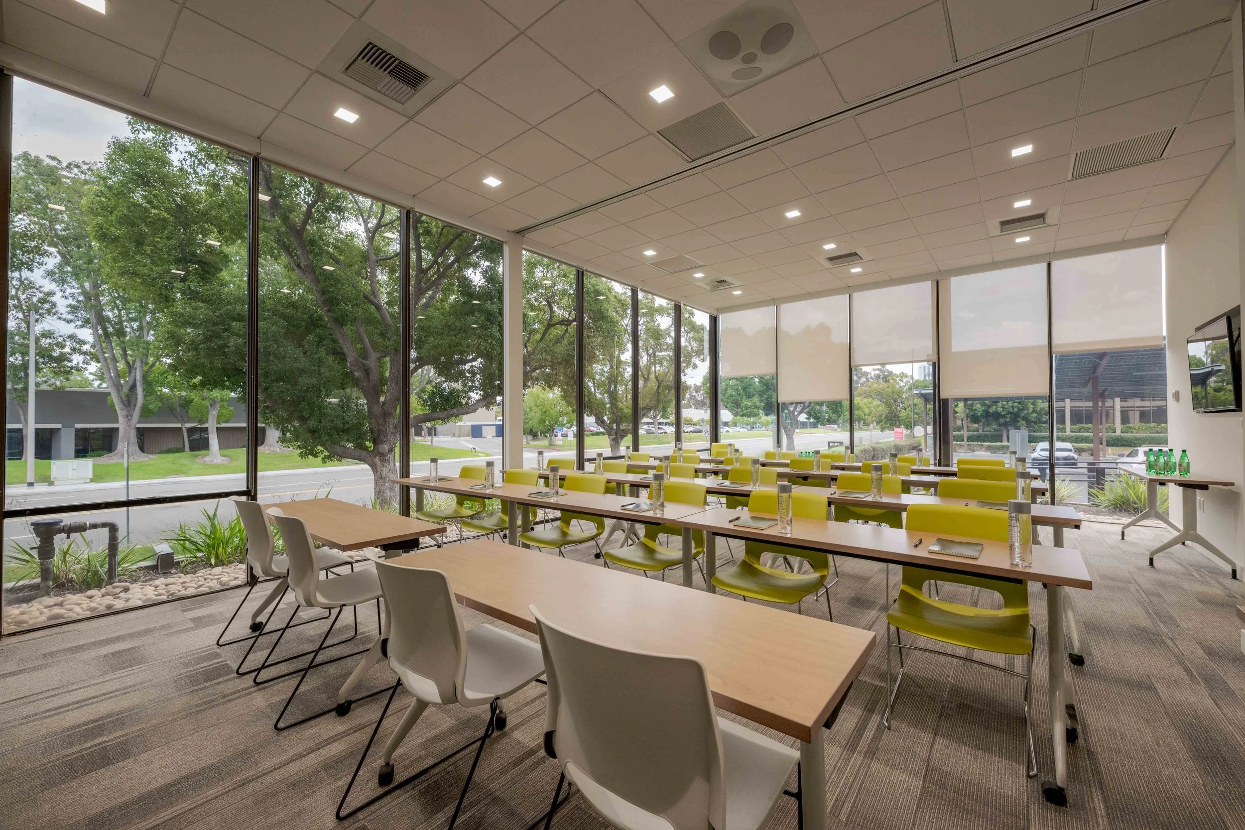 Large conference room with floor to ceiling windows and plenty of seating