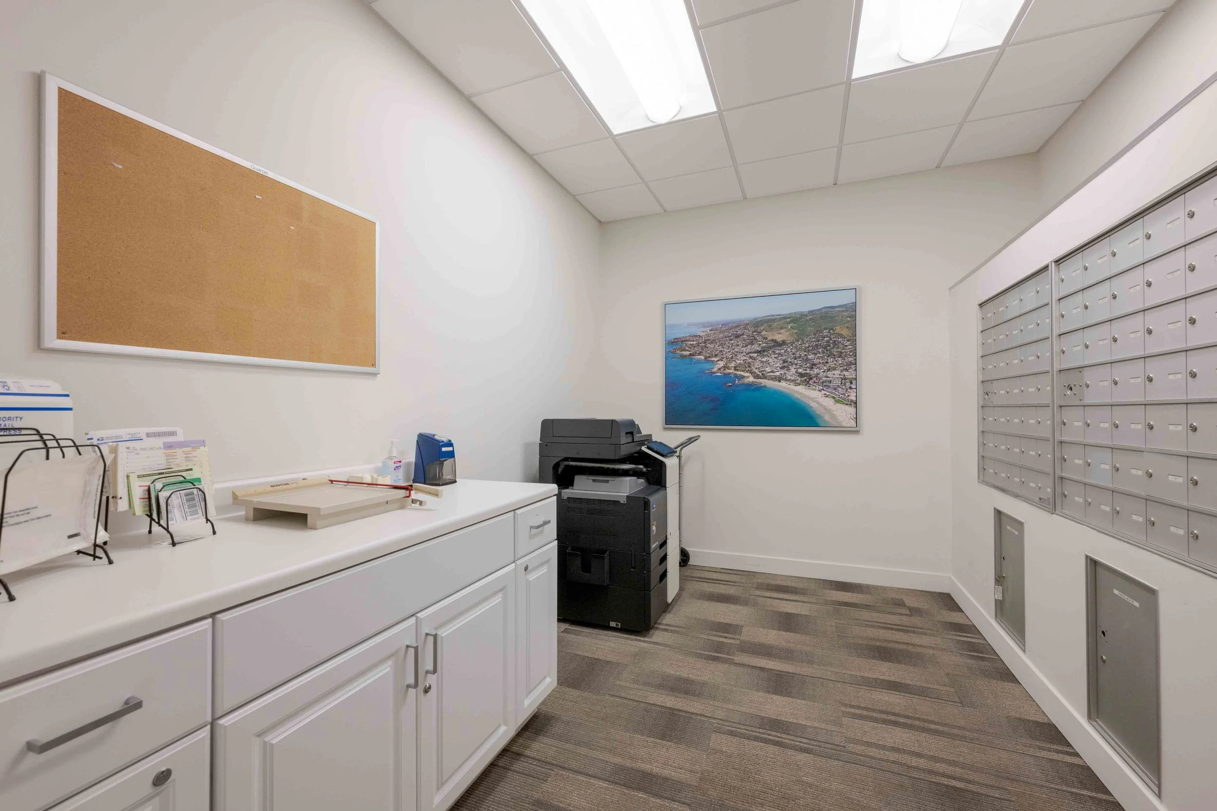 A mail room with a copier.