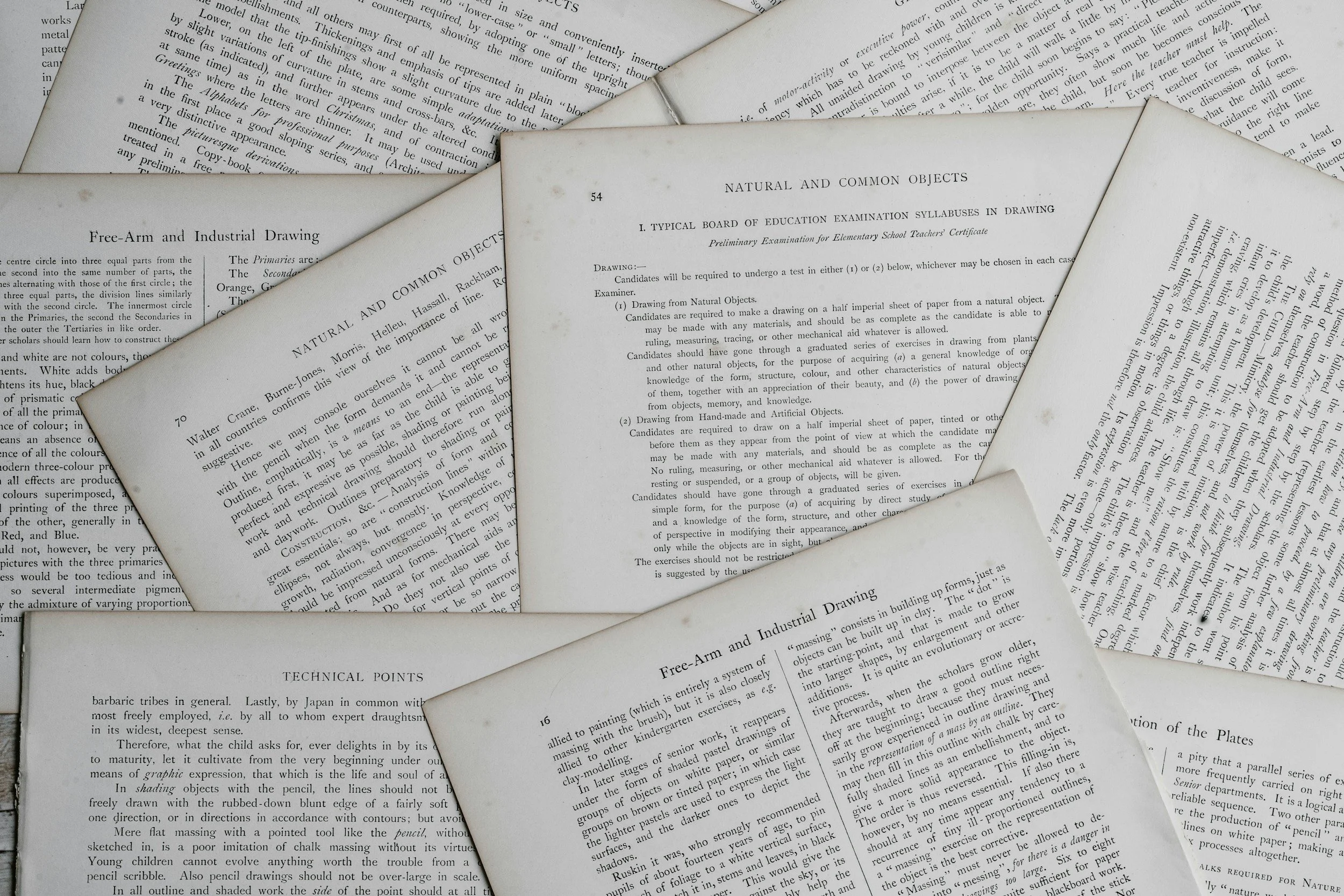 A stack of black-and-white pages and papers, some overlapping, containing text on subjects related to art, drawing, and education, with visible headings and instructions.