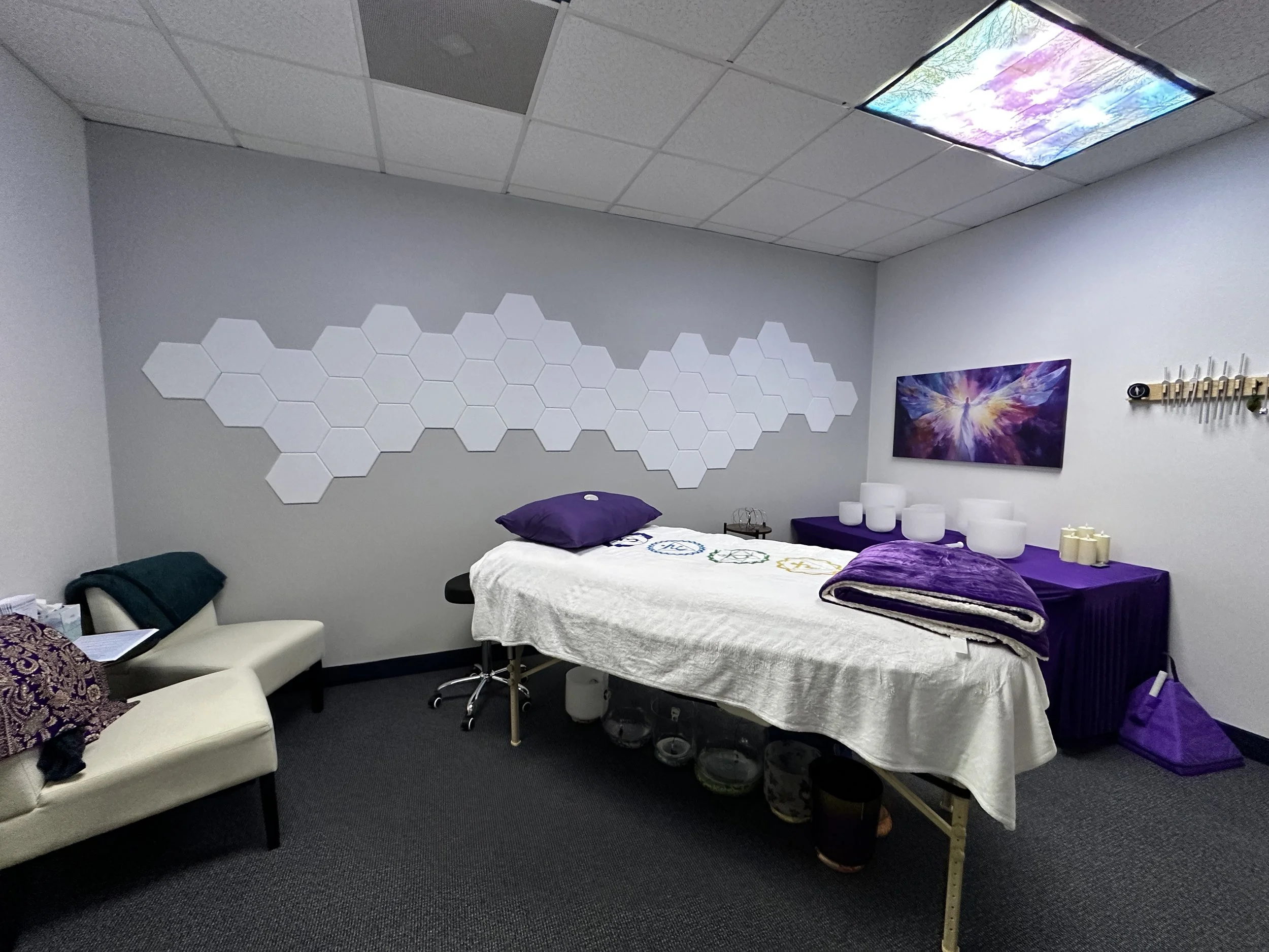 healing room with a healing bed and purple colors