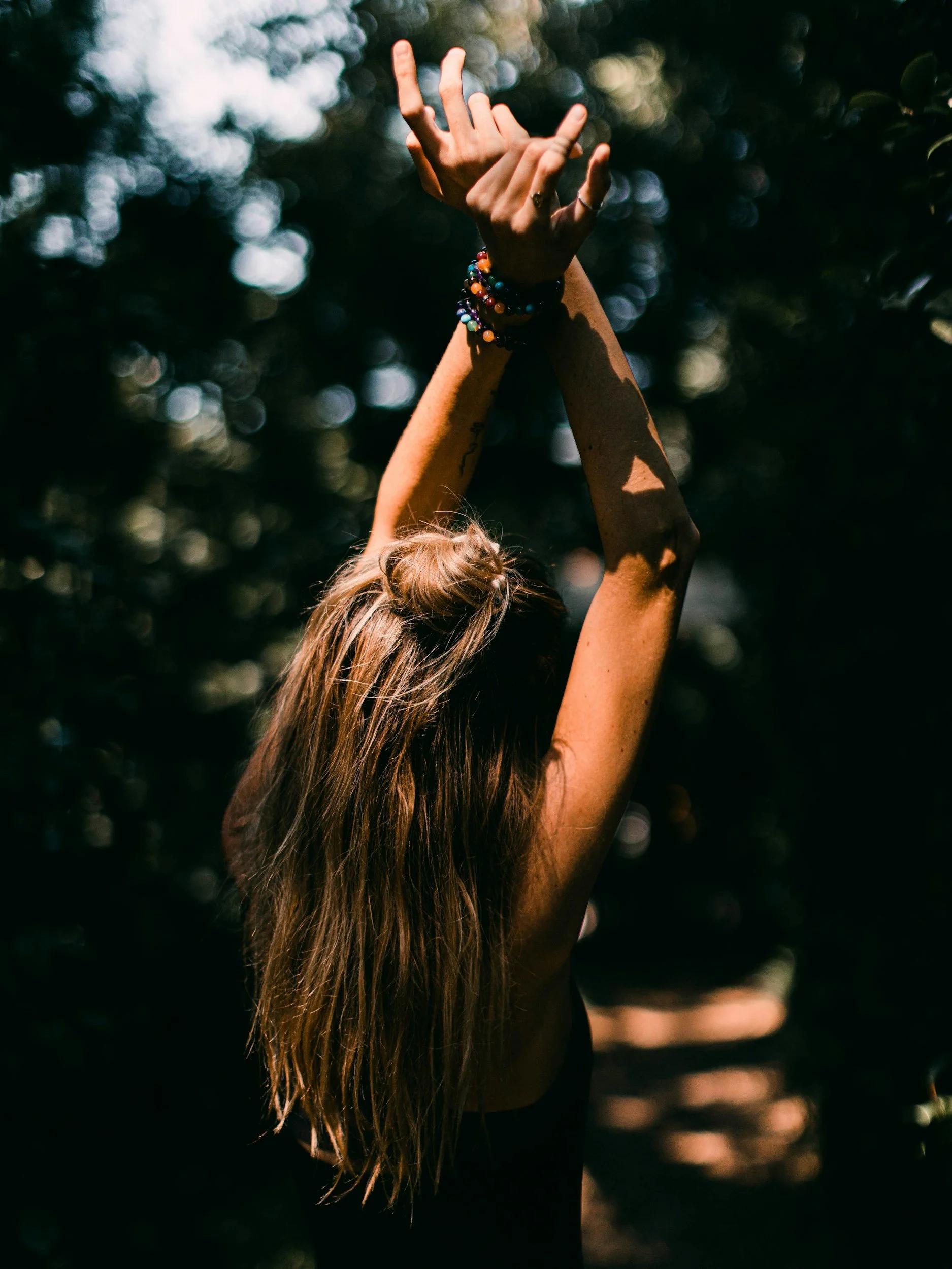girl with hands up in the air