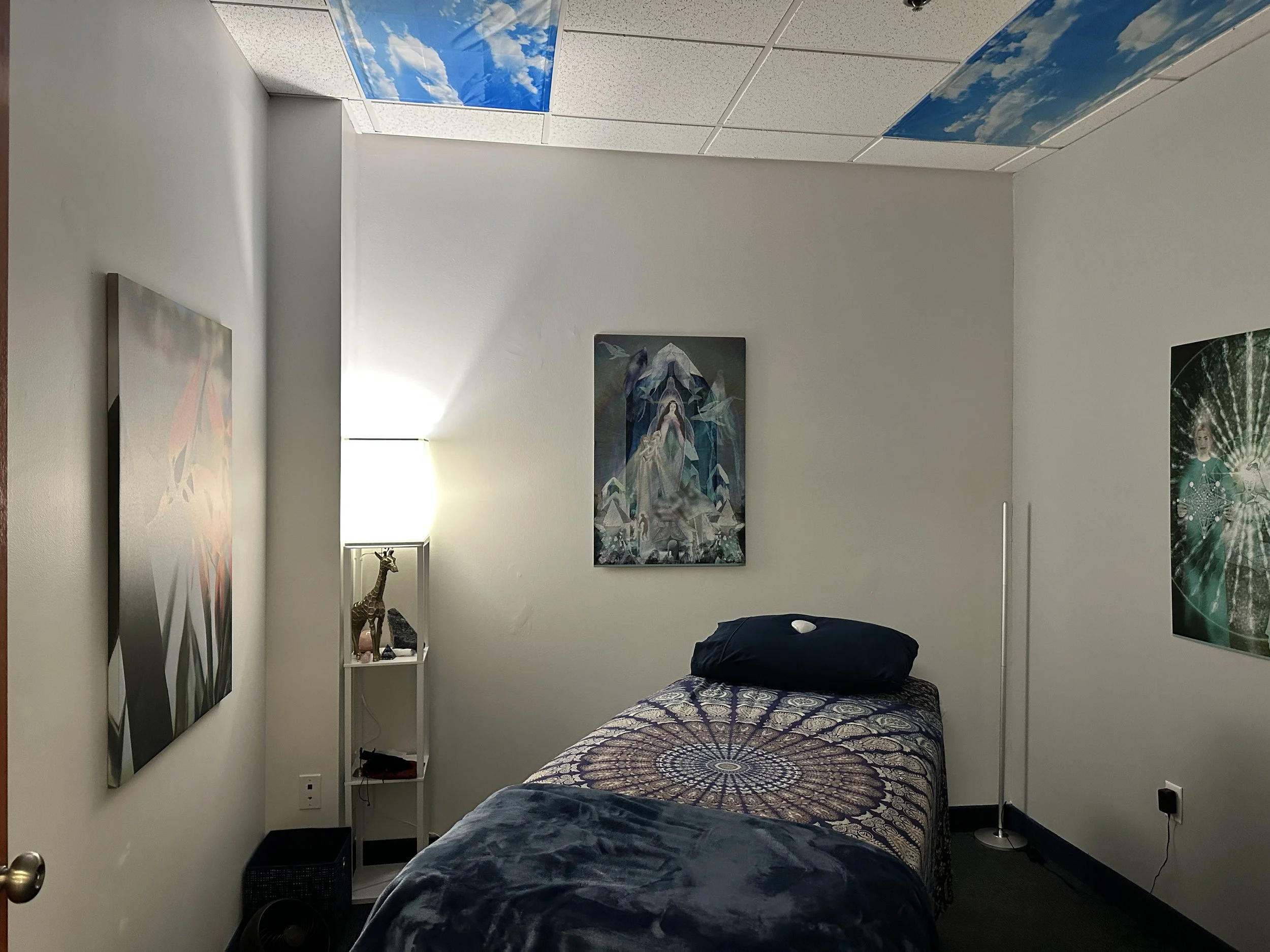 blue themed room with a massage bed/healing table