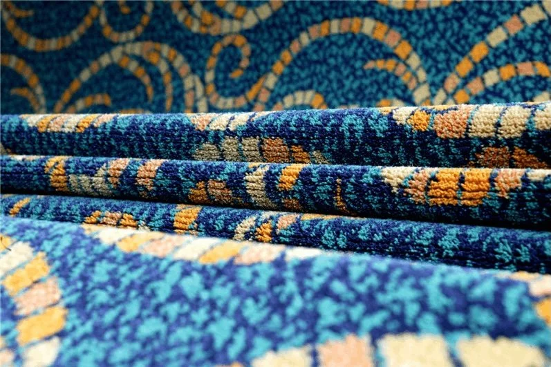 Close-up of woven Axminster carpet showing dense pattern construction