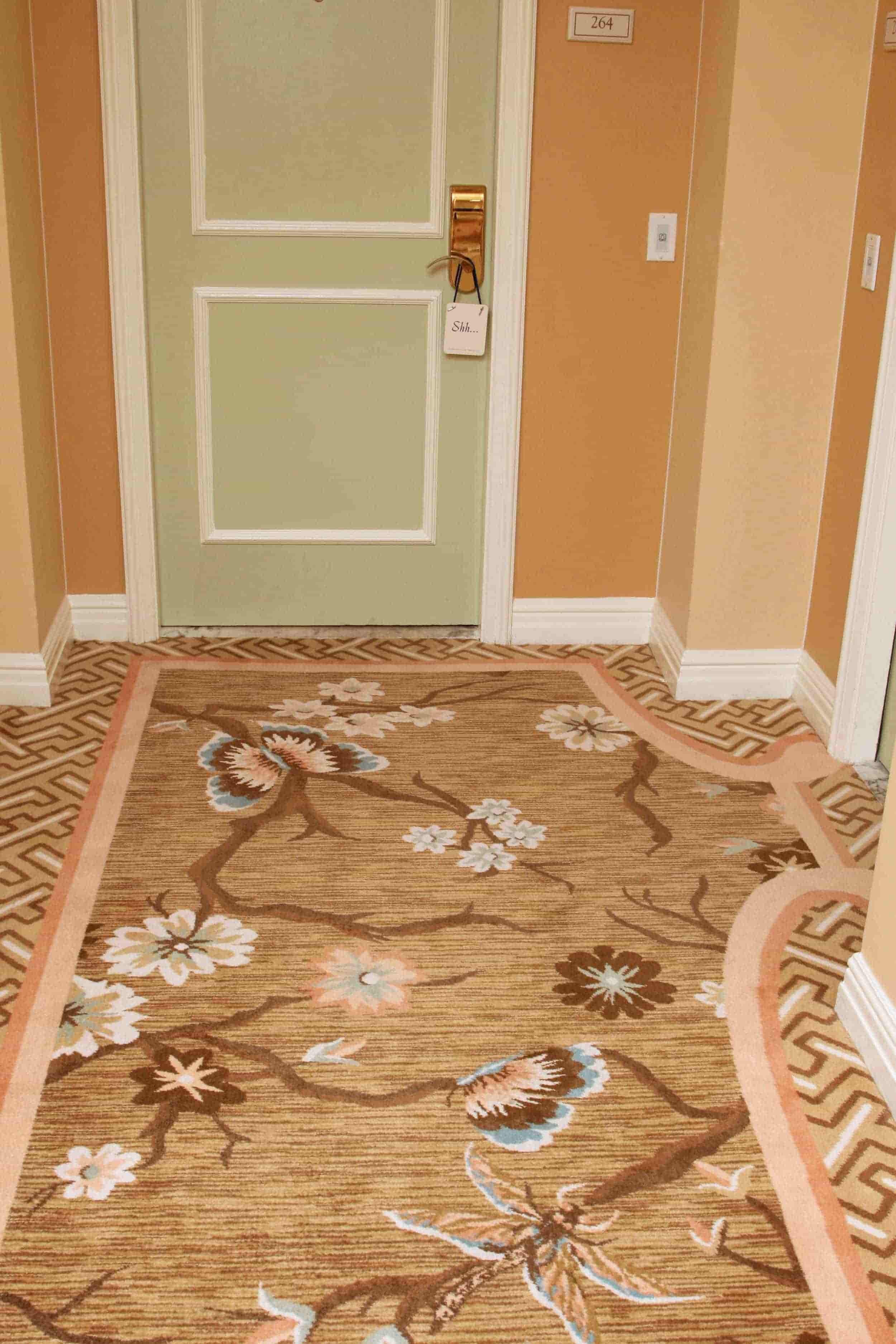 80/20 wool Axminster carpet with custom border in luxury hotel corridor