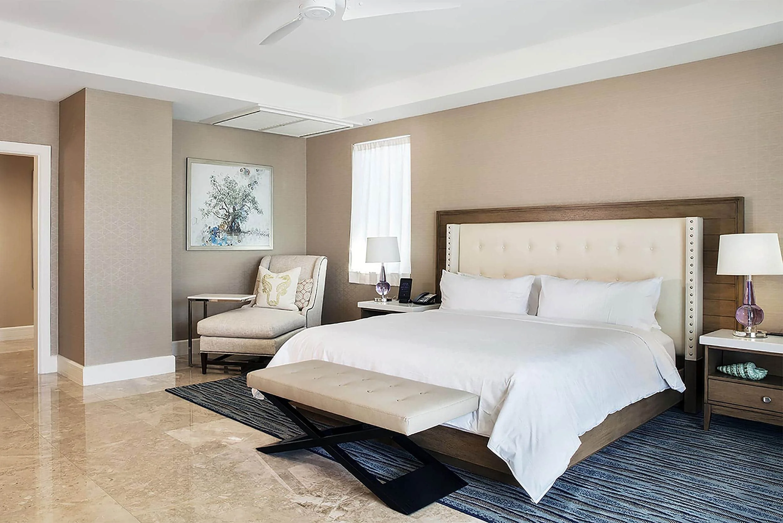 Solution-dyed nylon Axminster carpet installed in luxury hotel guest room