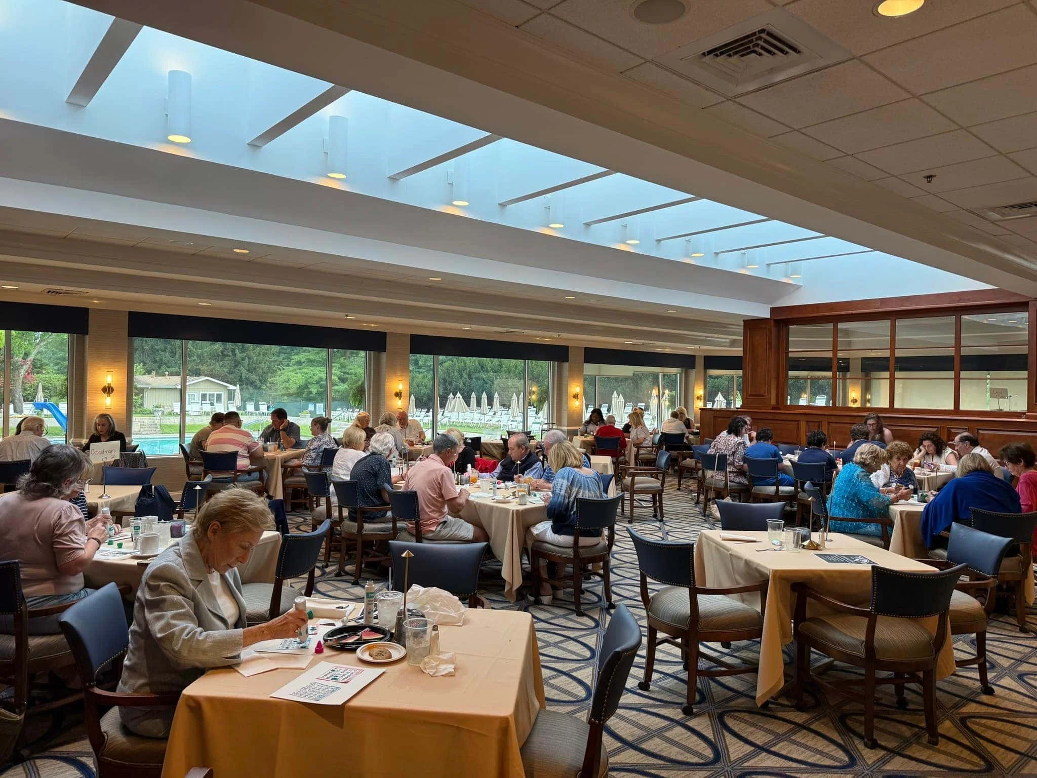 Solution-dyed nylon Axminster carpet installed in high-traffic country club dining room