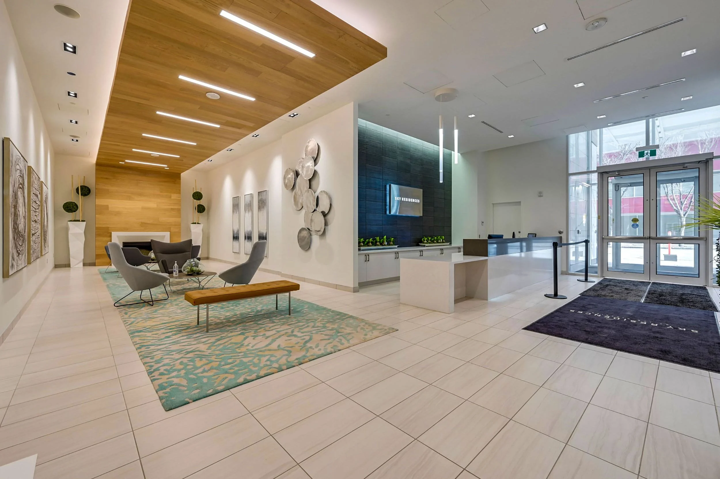 Large custom area rug in a commercial interior with hard-surface flooring