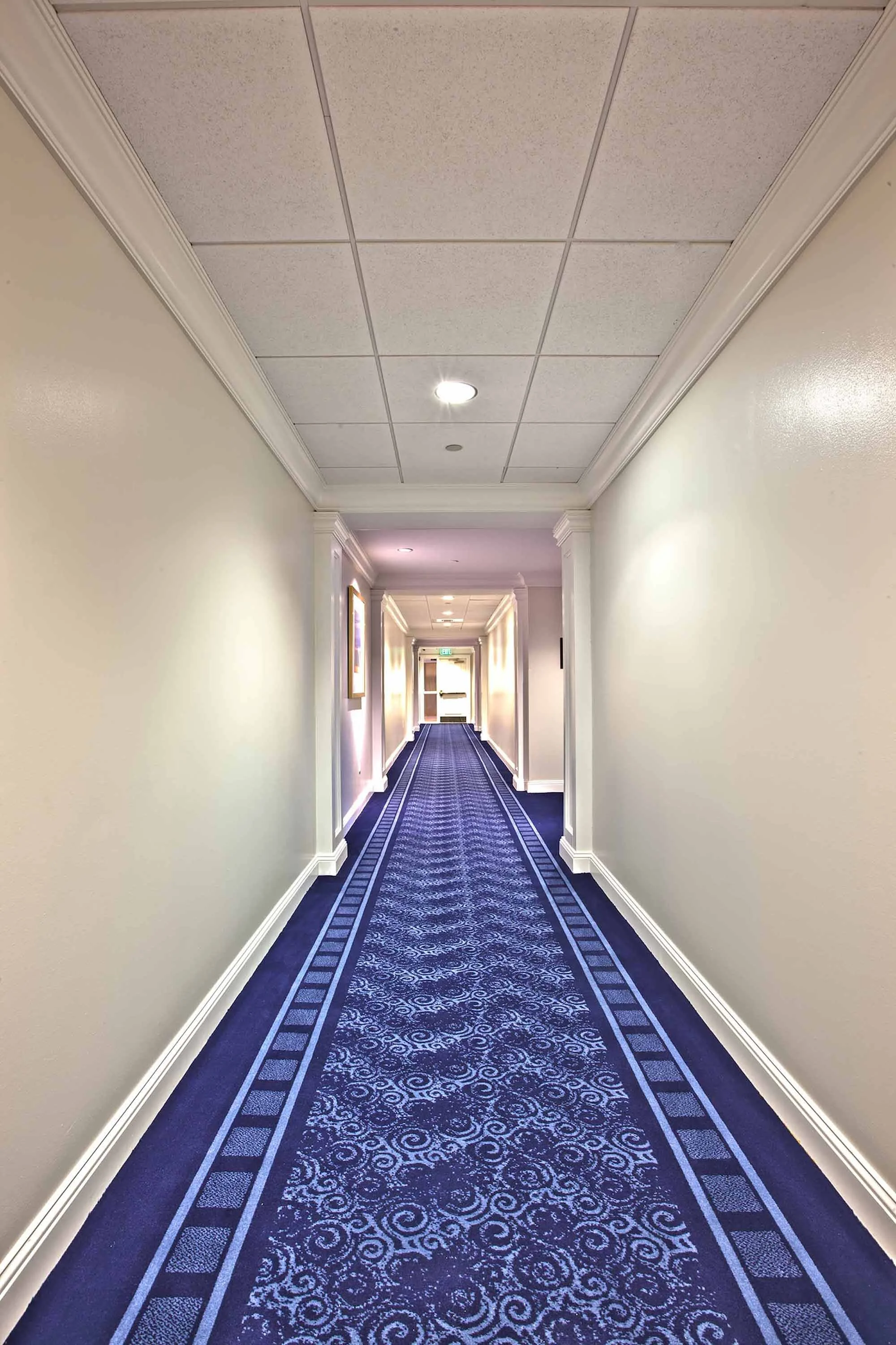 patterned carpet in a country club corridor designed for high traffic clubhouse areas