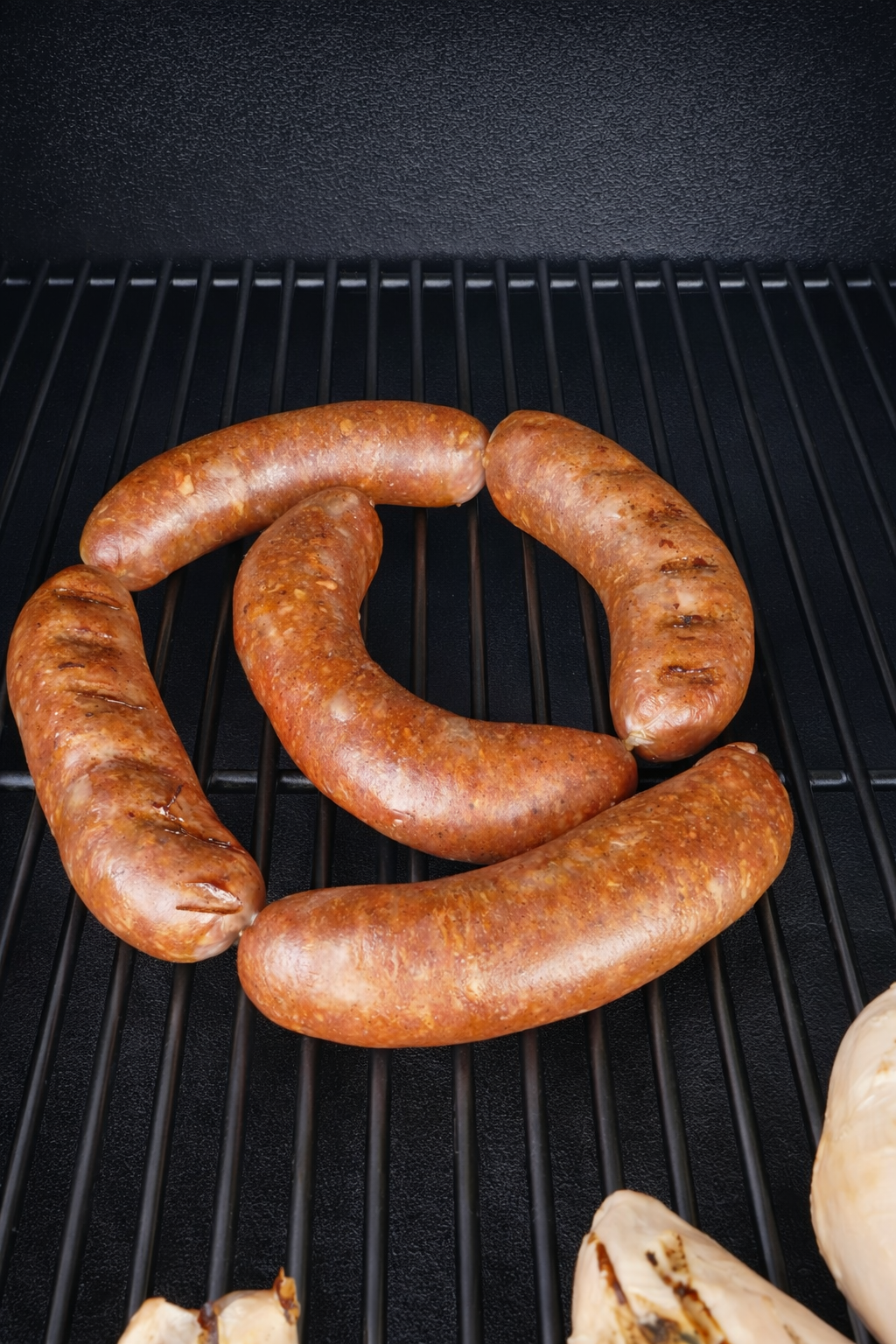 Grilled sausages on a clean grill.png