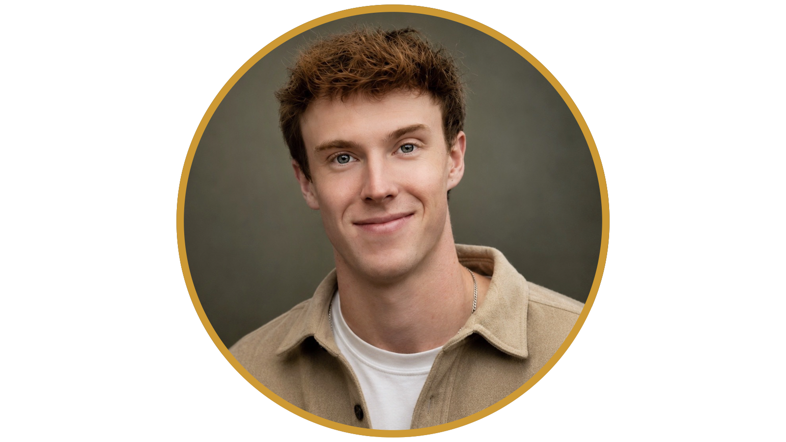 Headshot of a young man with brown hair and blue eyes, smiling, wearing a beige jacket over a white T-shirt, against a dark background.