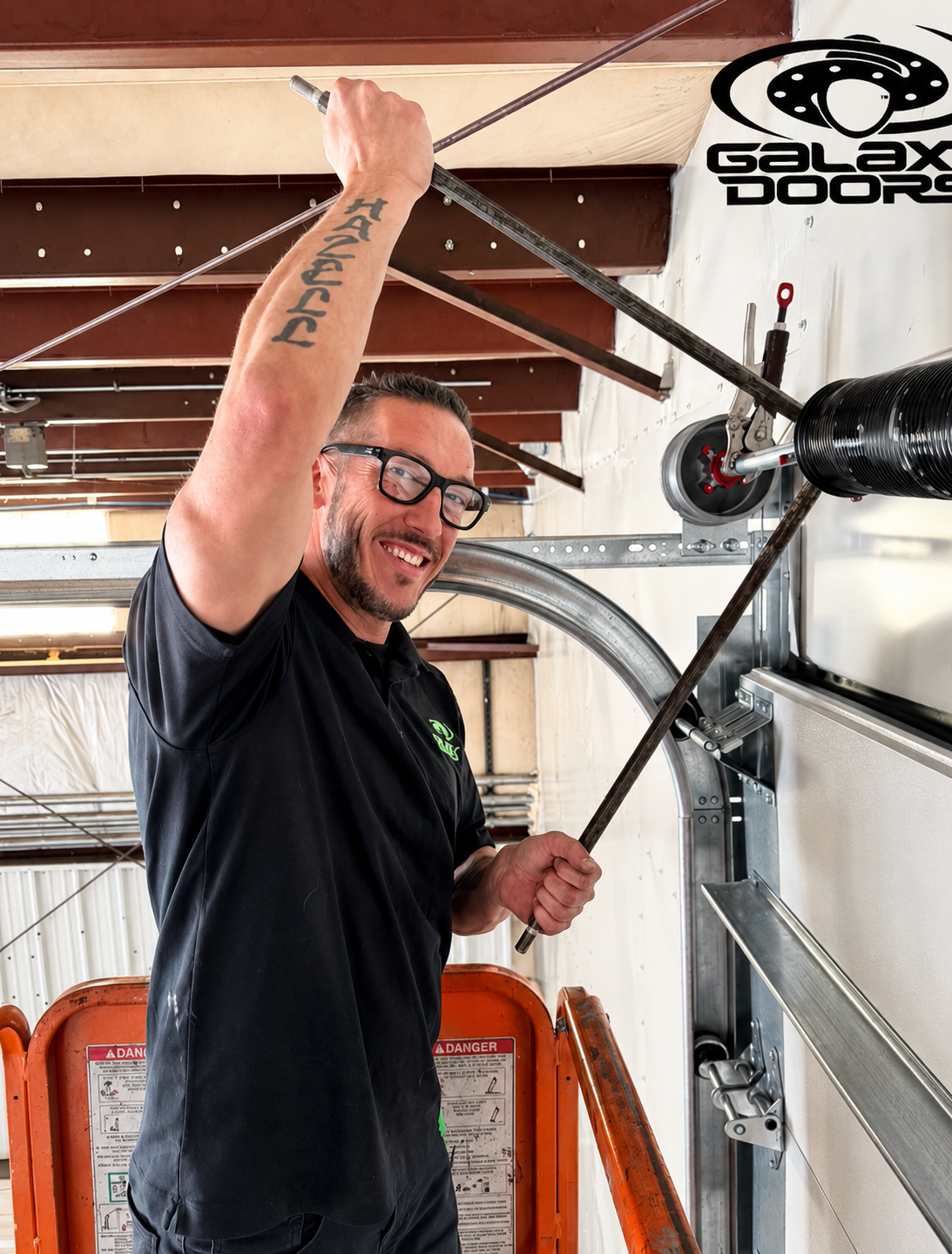 Chris DiMello of Galaxy Doors performing garage door spring repair in South Denver, Colorado