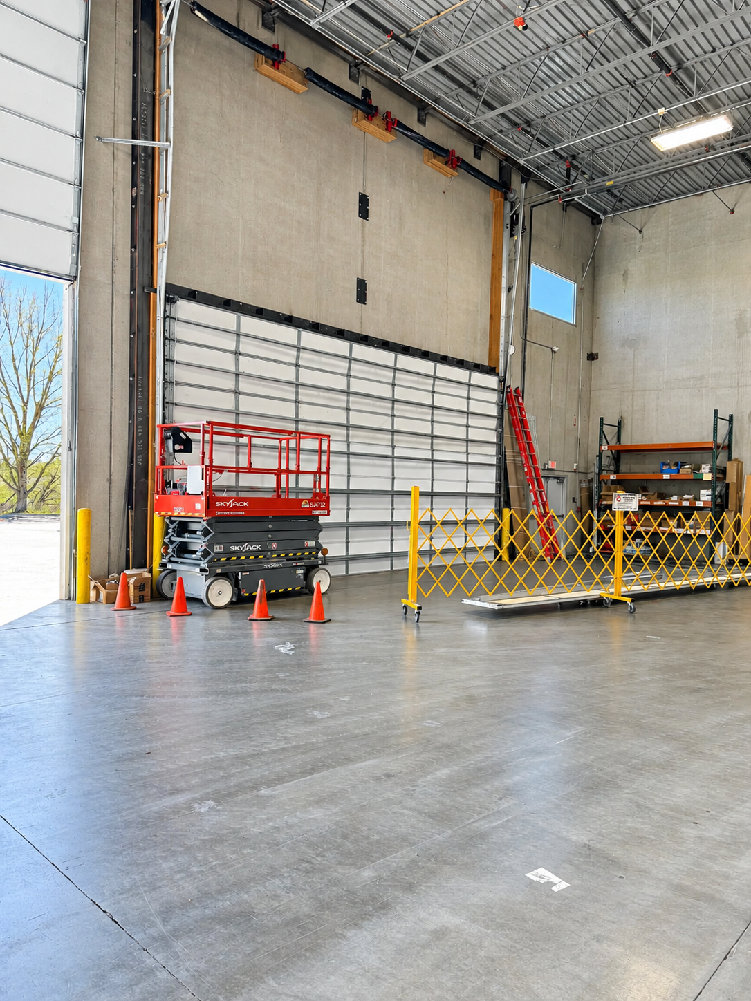 Commercial sectional garage door being serviced by Galaxy Doors in South Denver, Colorado