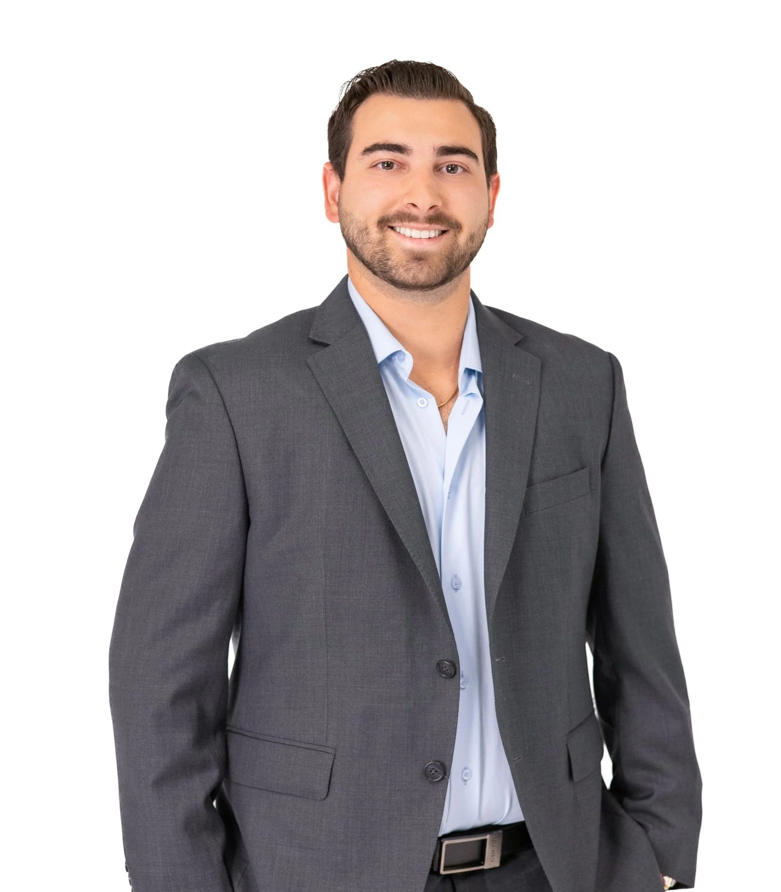 Professional lifestyle branding photography featuring a young man in a gray suit, captured in East Valley, AZ, perfect for corporate or real estate branding purposes.