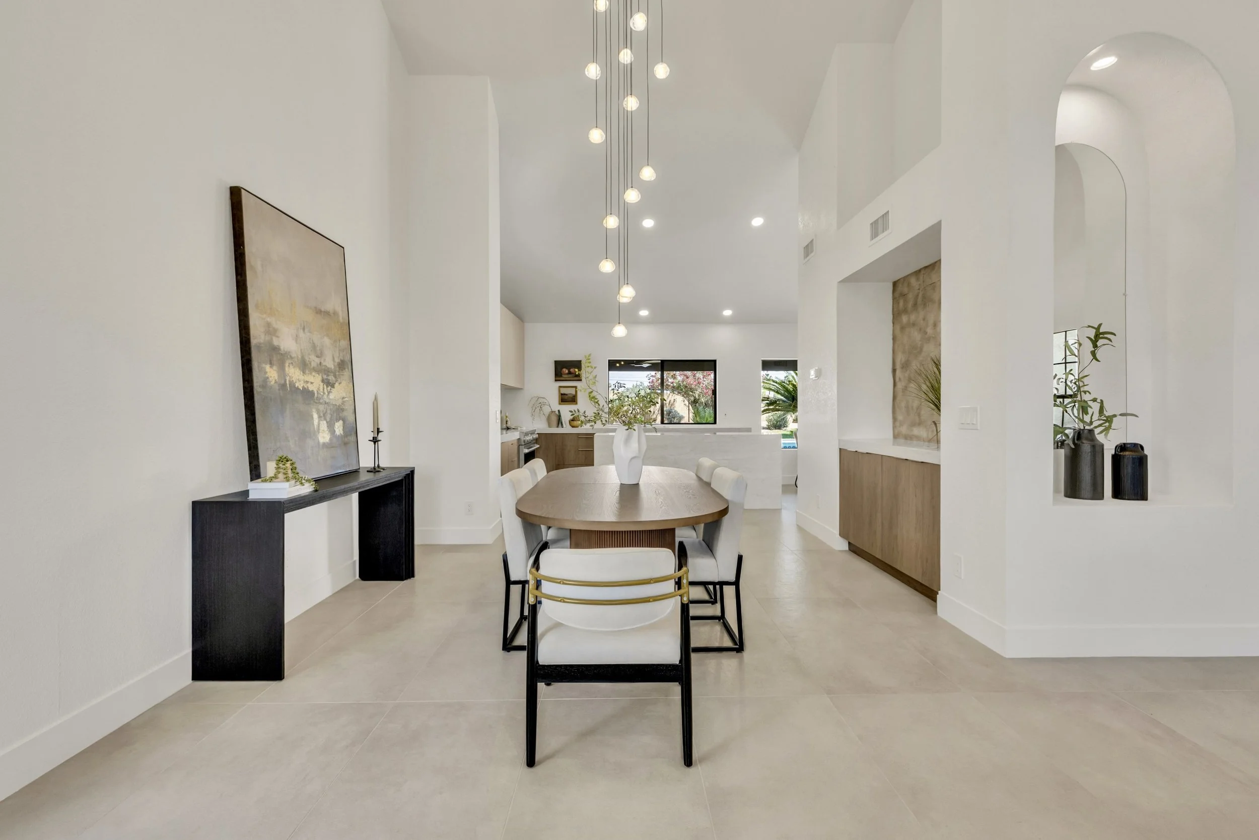 This modern dining room in Scottsdale, AZ features stylish furniture and elegant lighting, perfectly captured with expert real estate photography.