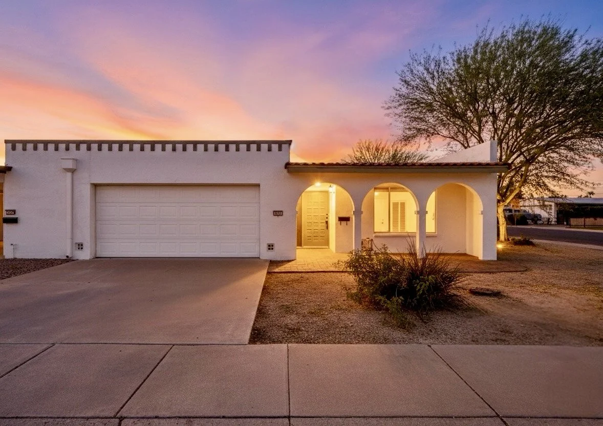 This real estate photography captures a charming home on S Wilson St in Tempe, AZ, with glowing twilight ambiance and desert landscaping, perfect for buyers seeking southwestern style.