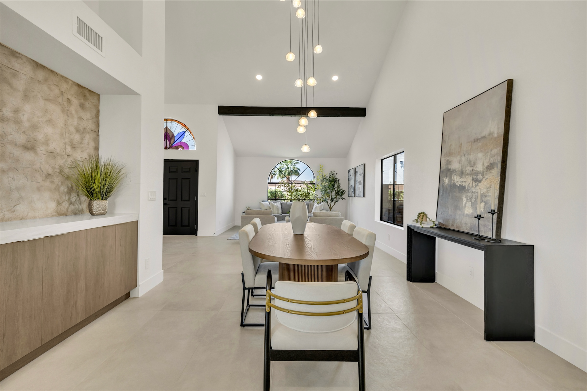 This modern dining and living area in Scottsdale, AZ features clean lines and natural light, captured beautifully through expert real estate photography.