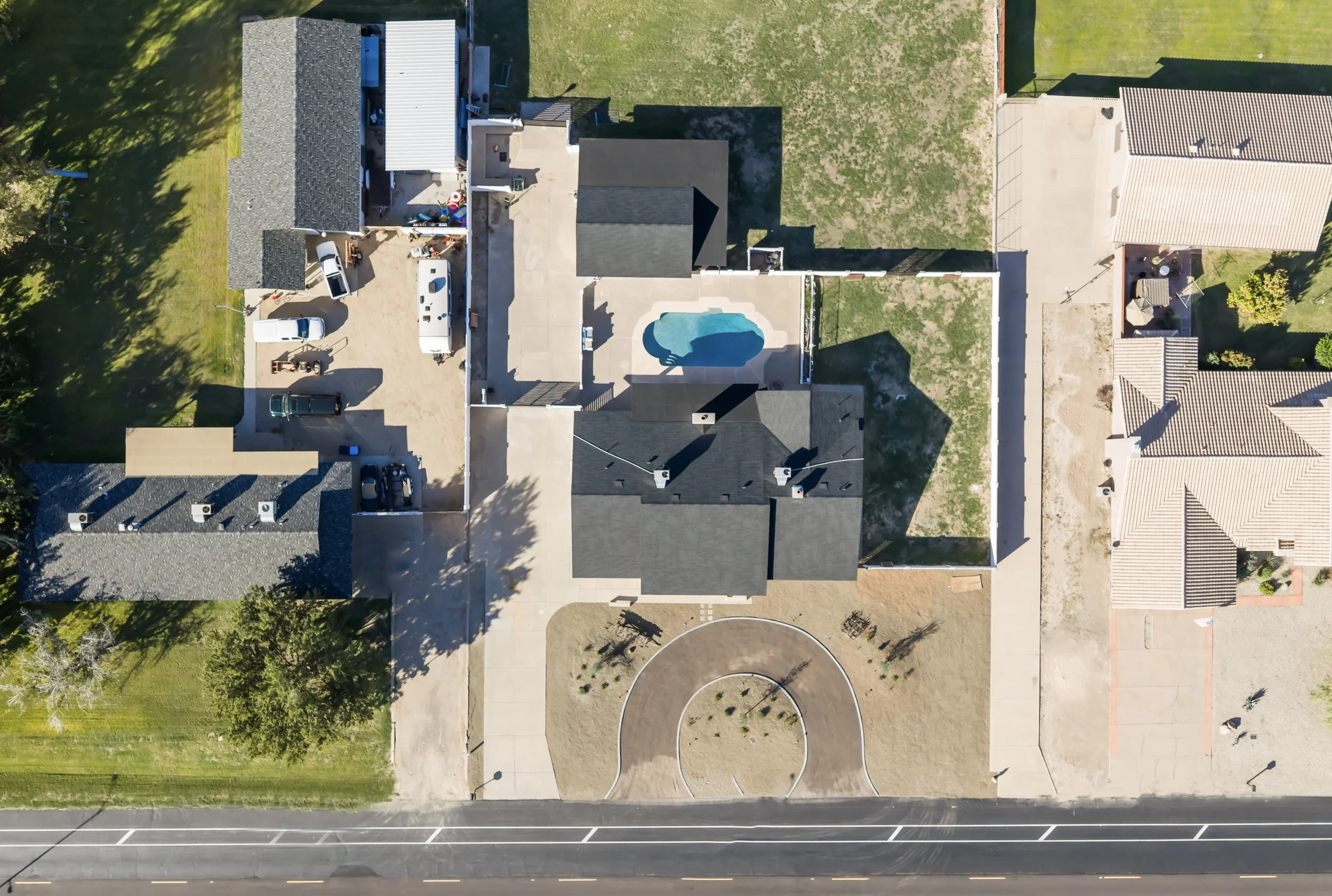 Aerial view of an Arizona backyard with putting green and desert landscaping.