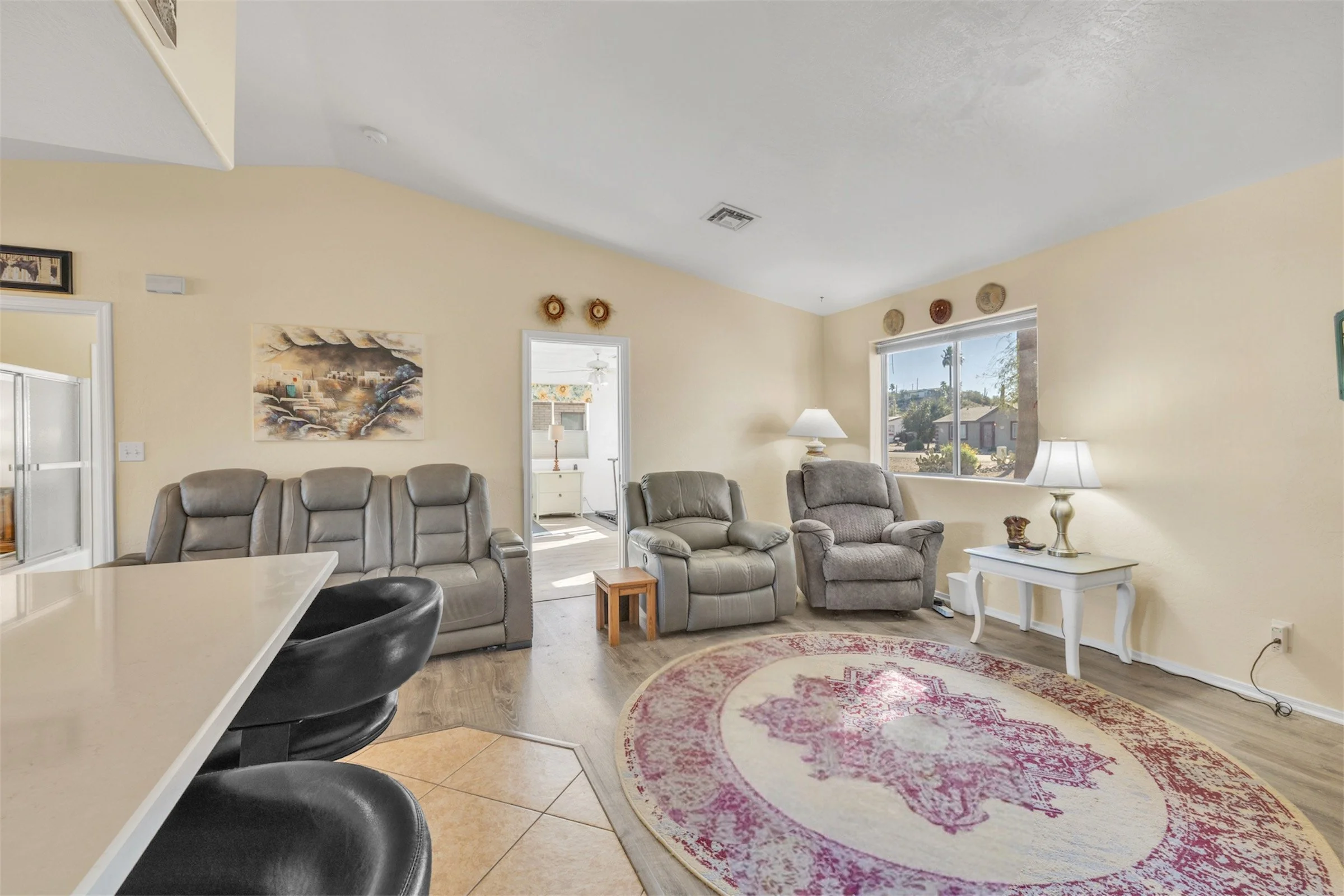Bright living room with comfortable seating and natural light captured through real estate photography in Queen Valley, AZ, showcasing a cozy and inviting home interior.