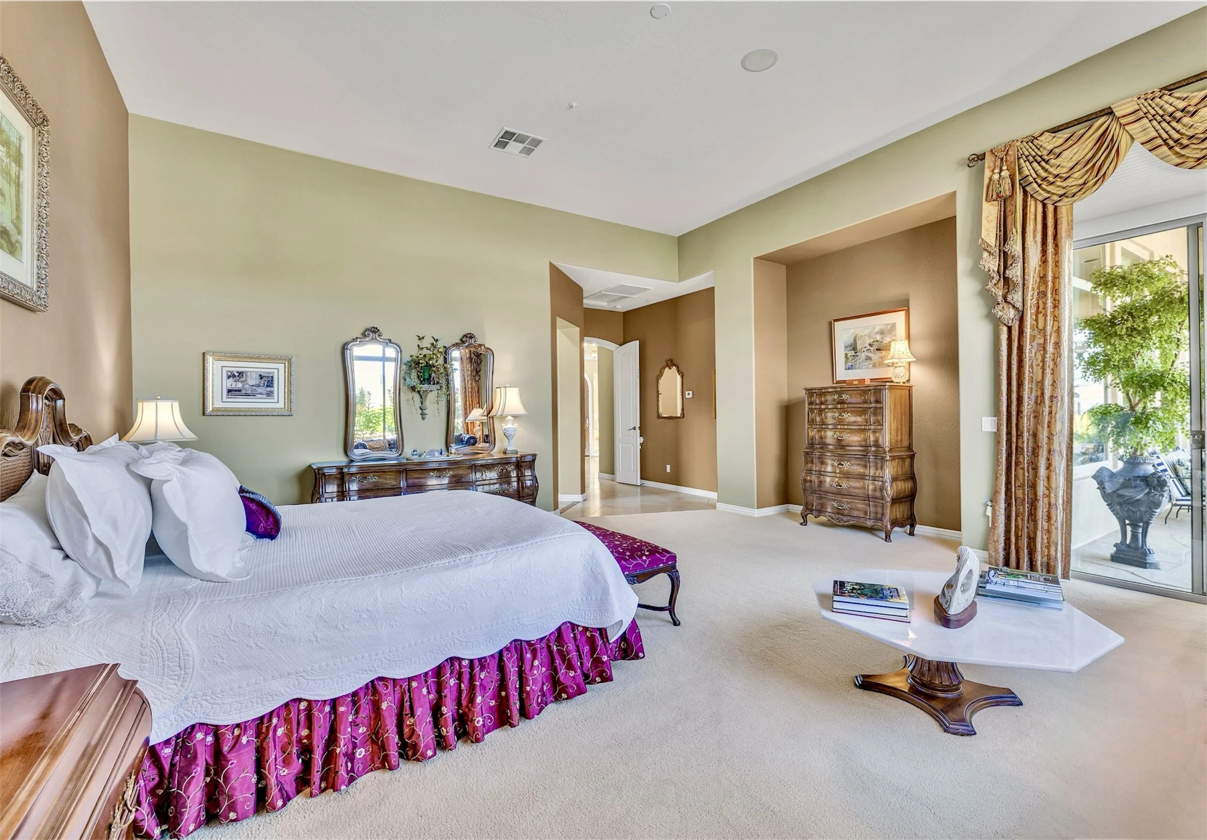 This bright bedroom interior in Scottsdale, AZ, showcases elegant furnishings and large windows, captured with professional real estate photography to highlight the home's inviting atmosphere.