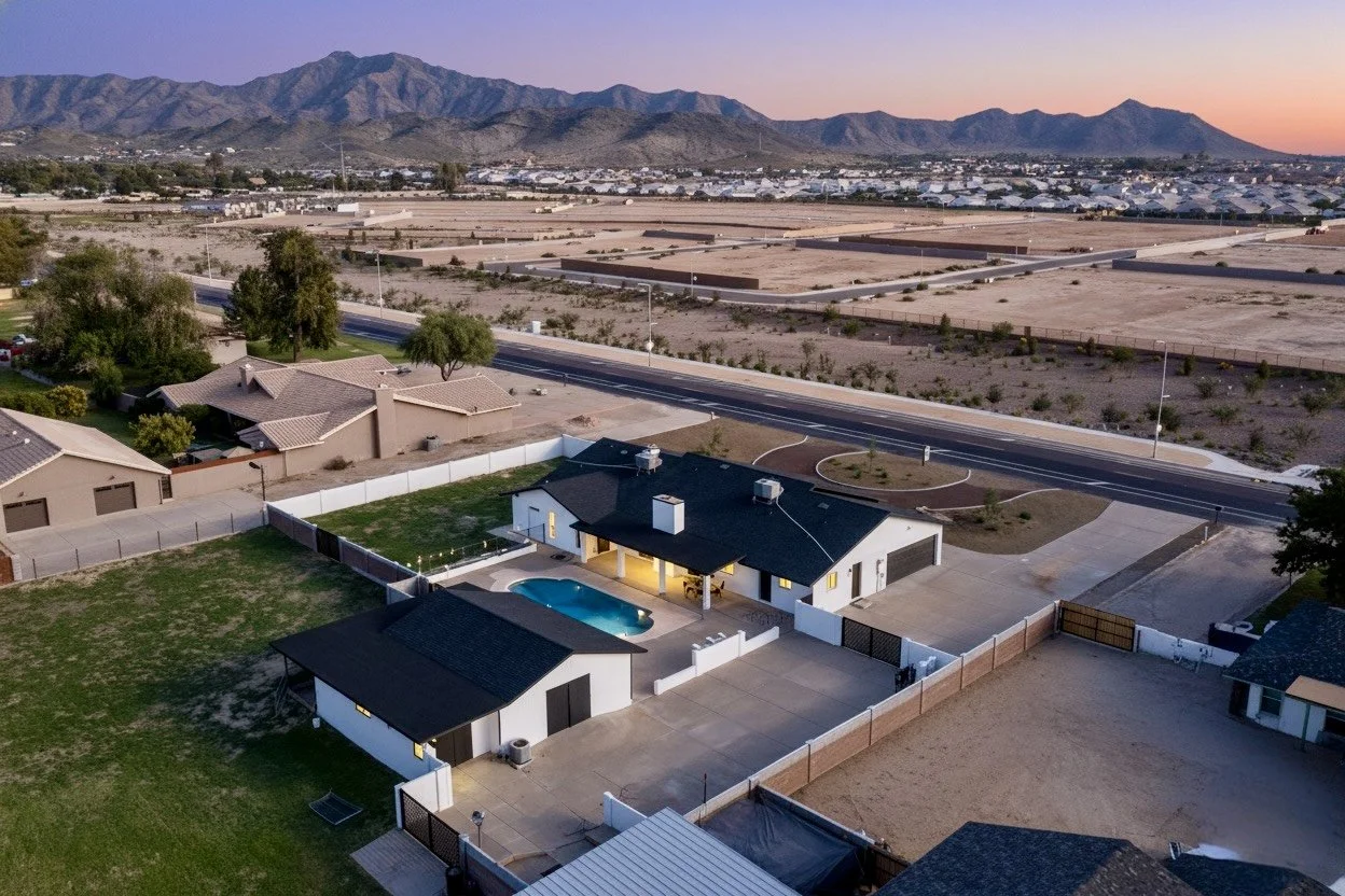 Daytime drone view of a modern home exterior in Arizona.