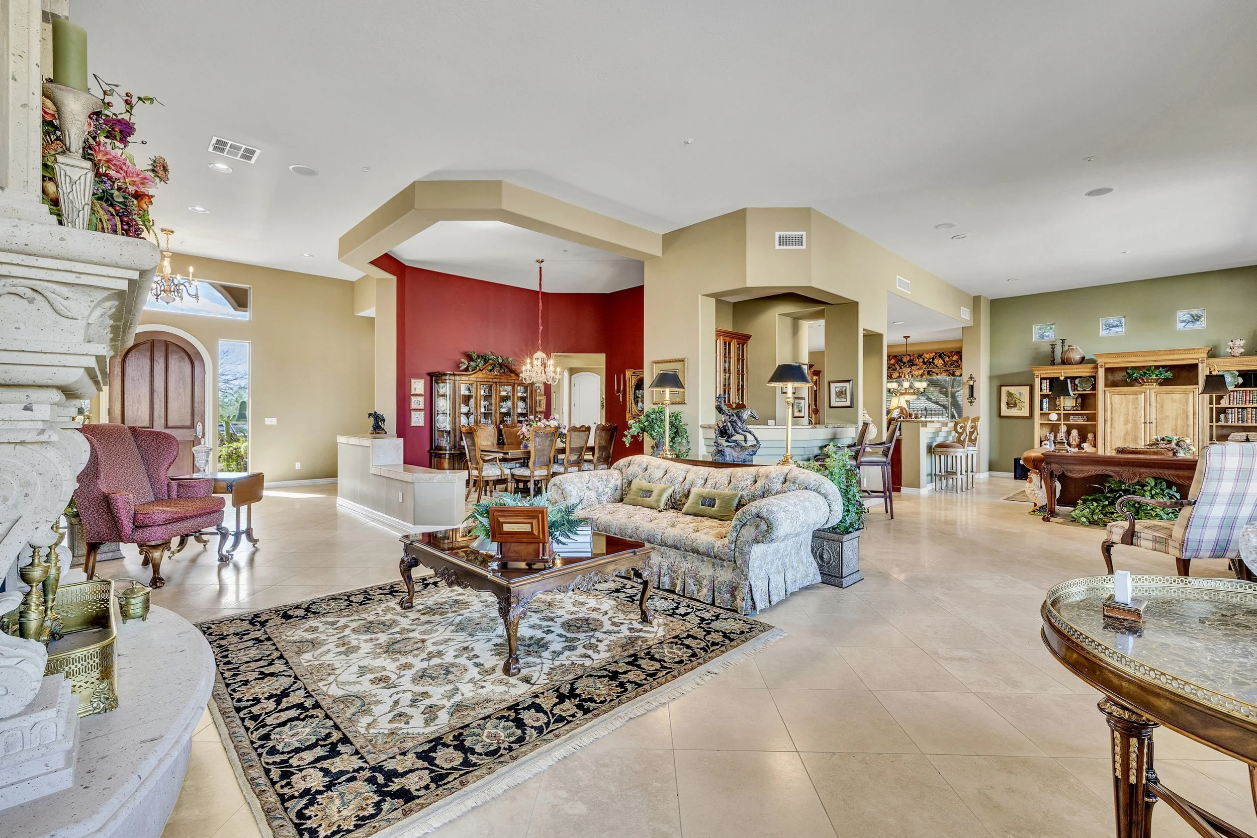 This bright and spacious living room and dining area in Scottsdale, AZ, showcases elegant decor and open floor design, featured in premium real estate photography.
