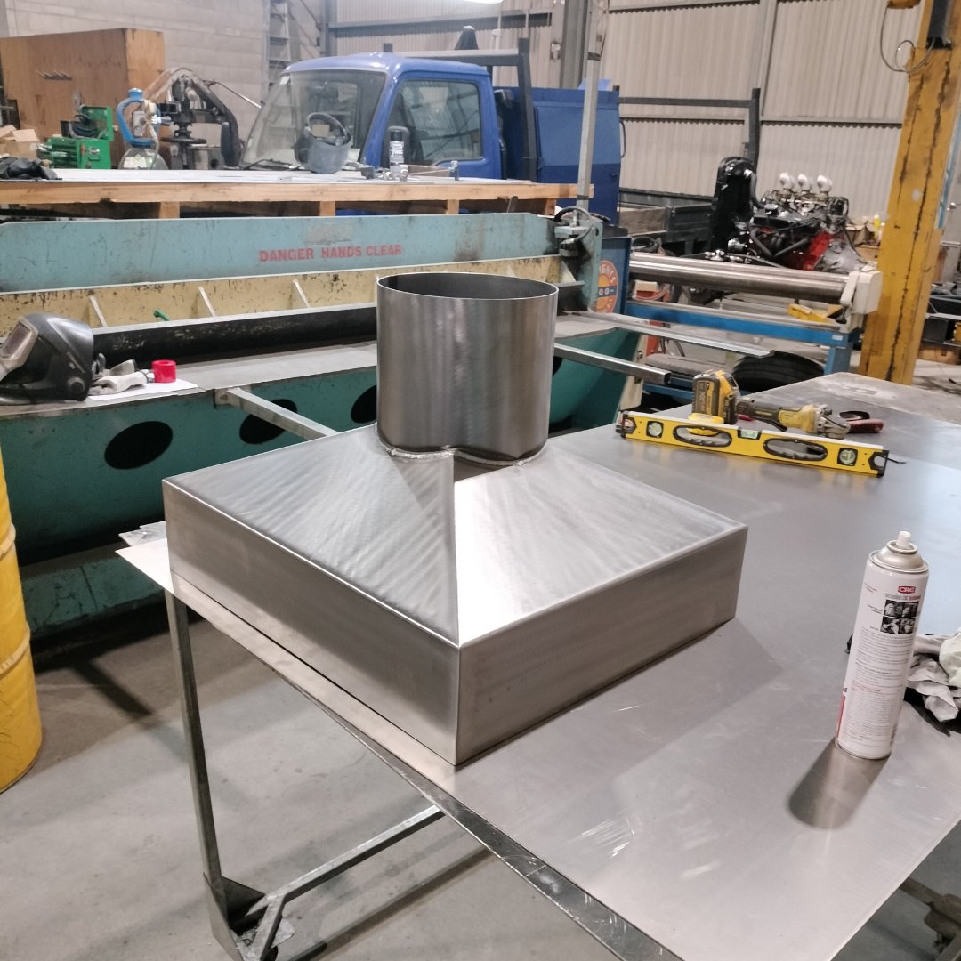 Custom offset chimney cap.