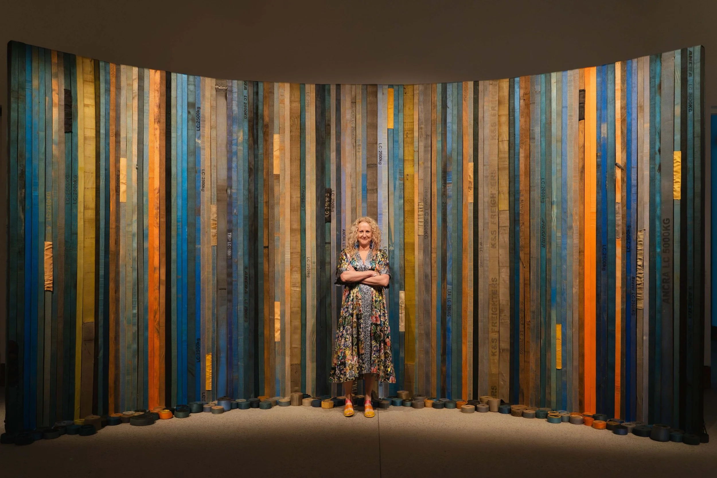 Jane Skeer pictured with artwork ‘True Blue’ 2023. Used ratchet tie downs bought on eBay, Gumtree and Grays Online from Bunbury, Albany, Whyalla, Port Augusta., Freeling, Alice Springs, Mount Gambier, Millicent, Adelaide, Melbourne, Sydney, Brisbane 