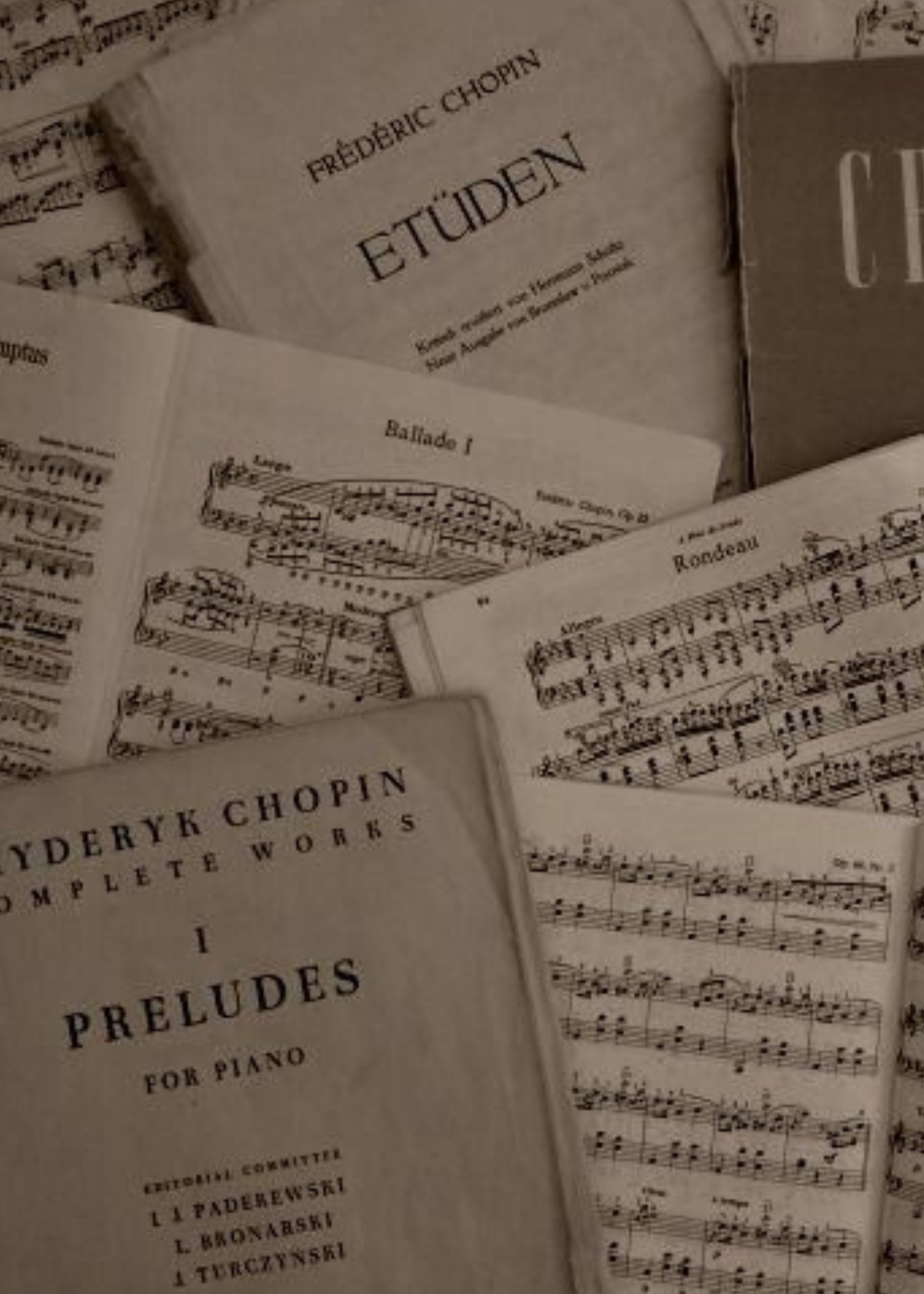 Open sheet music books and music sheets with musical notes.