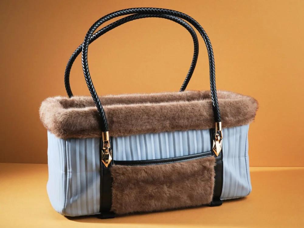 Blue fashion bag style animal tote with brown fur trim