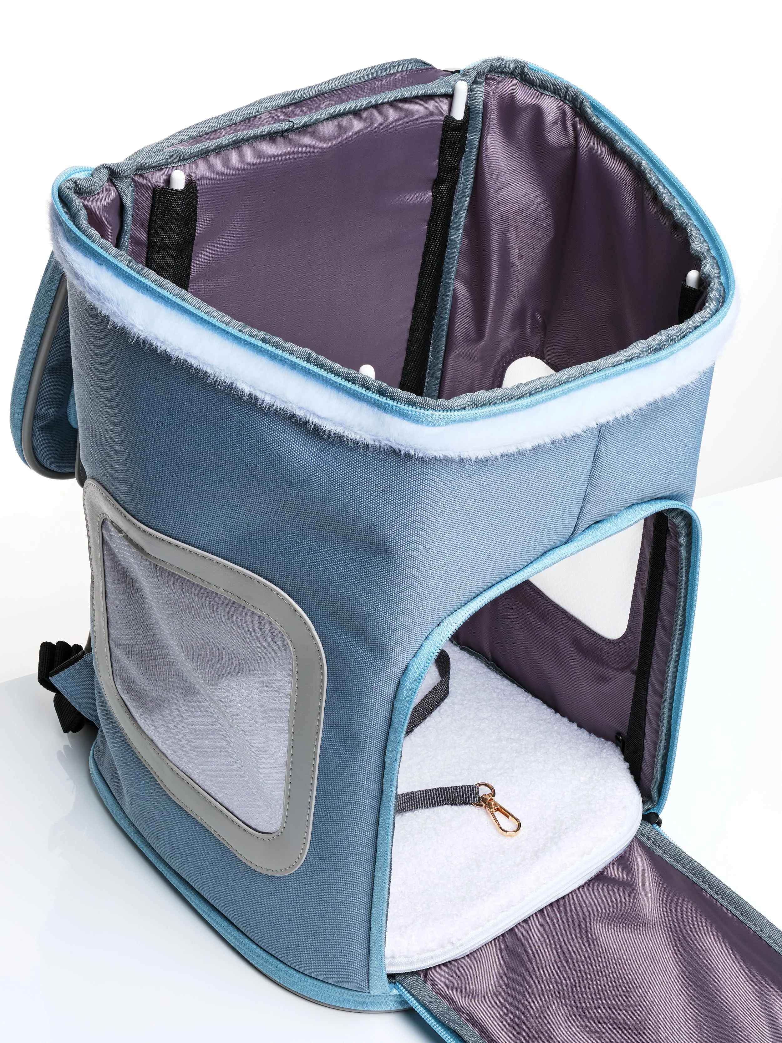 The KibbleTime Sacre Bleu Backpack pet carrier with the top and front panels opened.