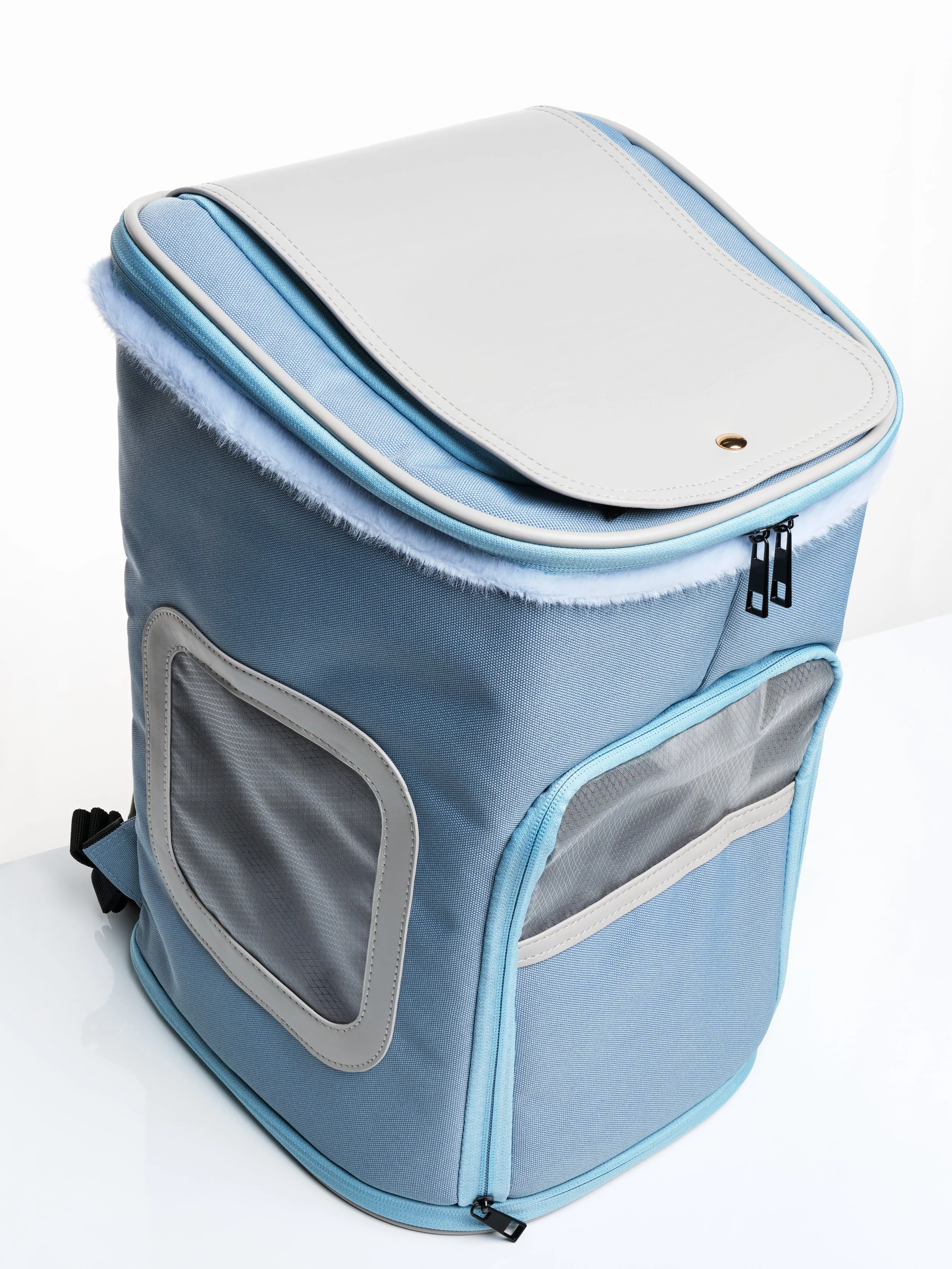 The KibbleTime Sacre Bleu Backpack pet carrier with the top flap closed.