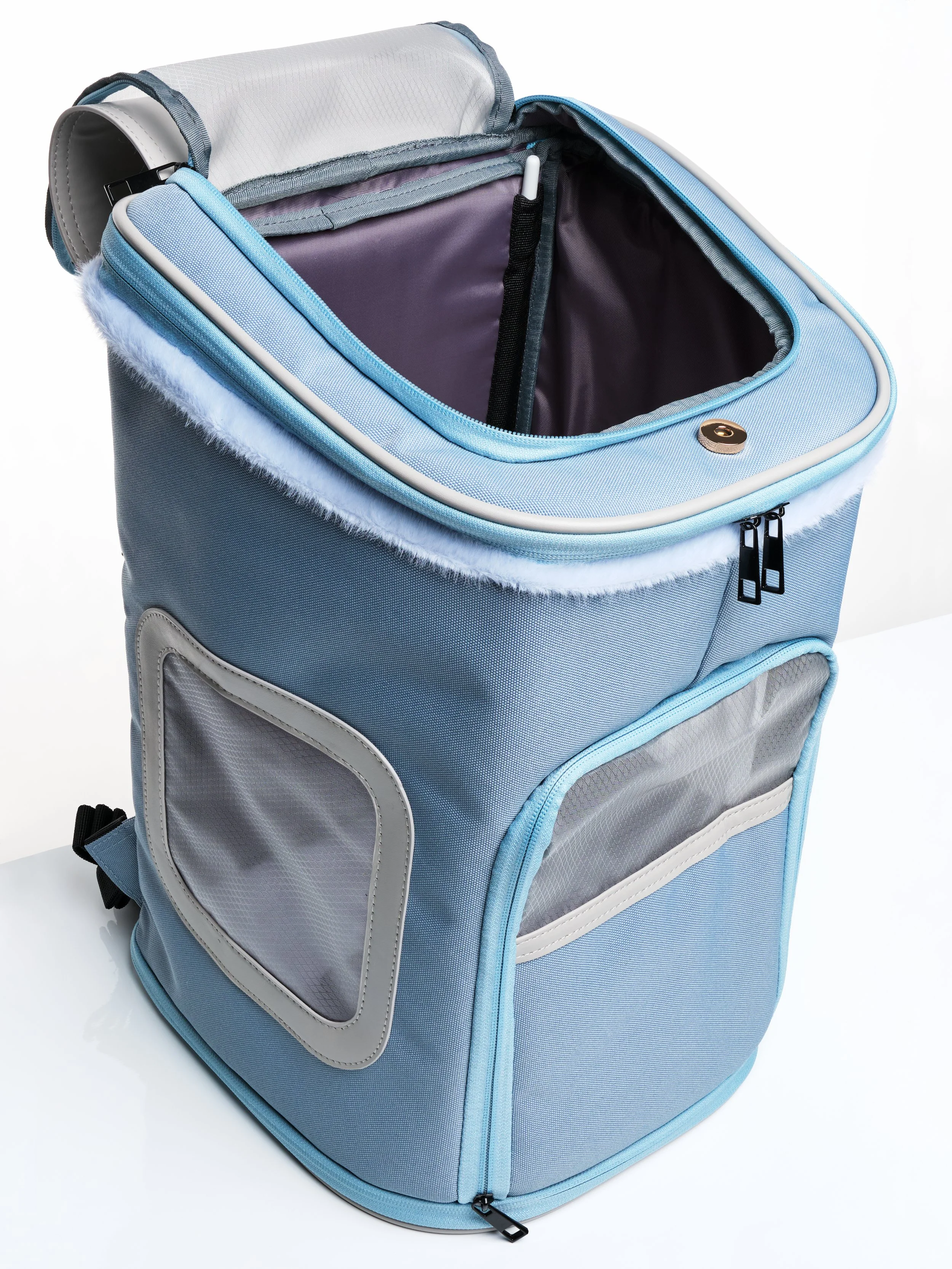 The KibbleTime Sacre Bleu Backpack pet carrier with the top flap and screen opened.