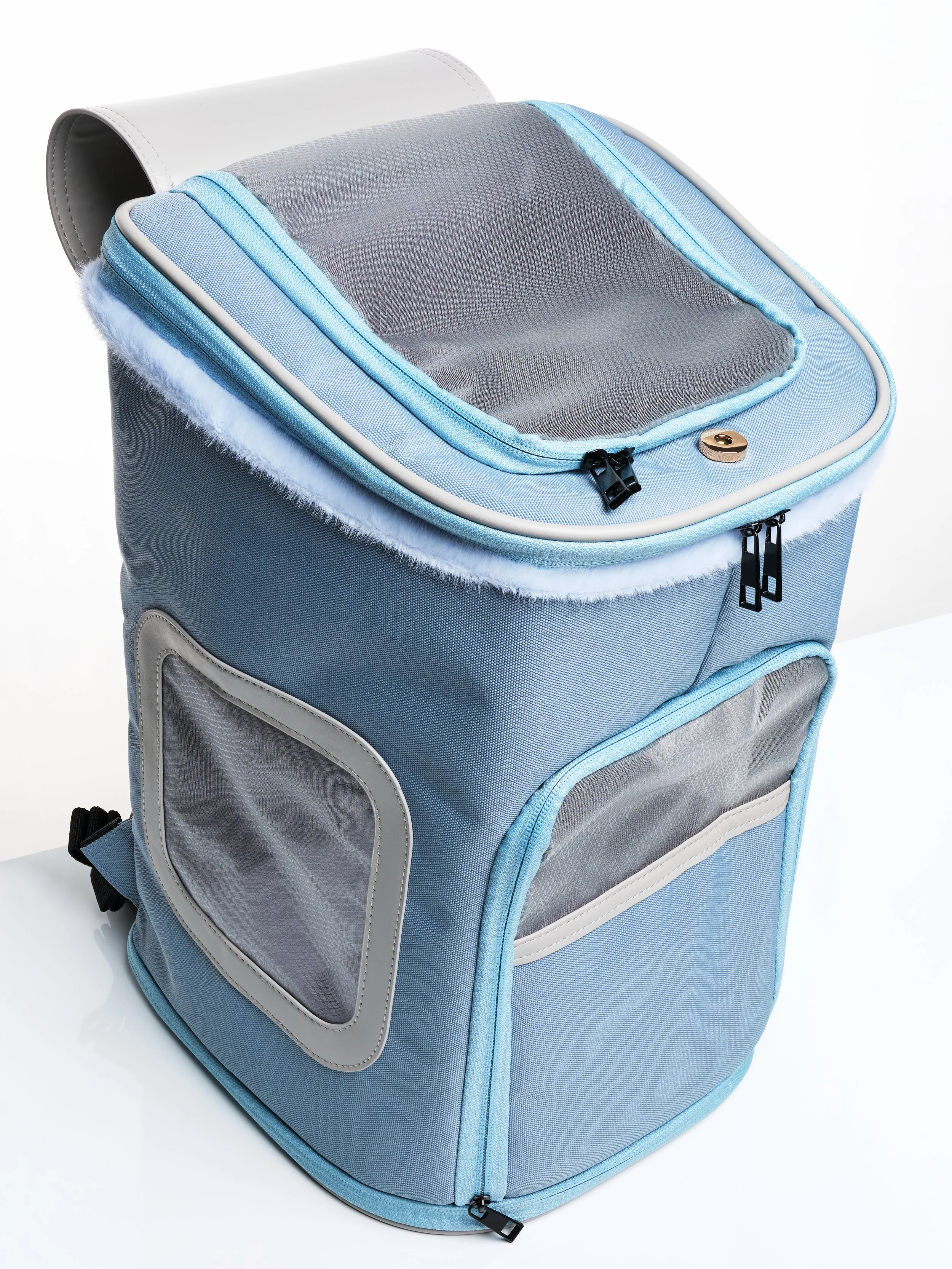 The KibbleTime Sacre Bleu Backpack pet carrier with the top flap opened.