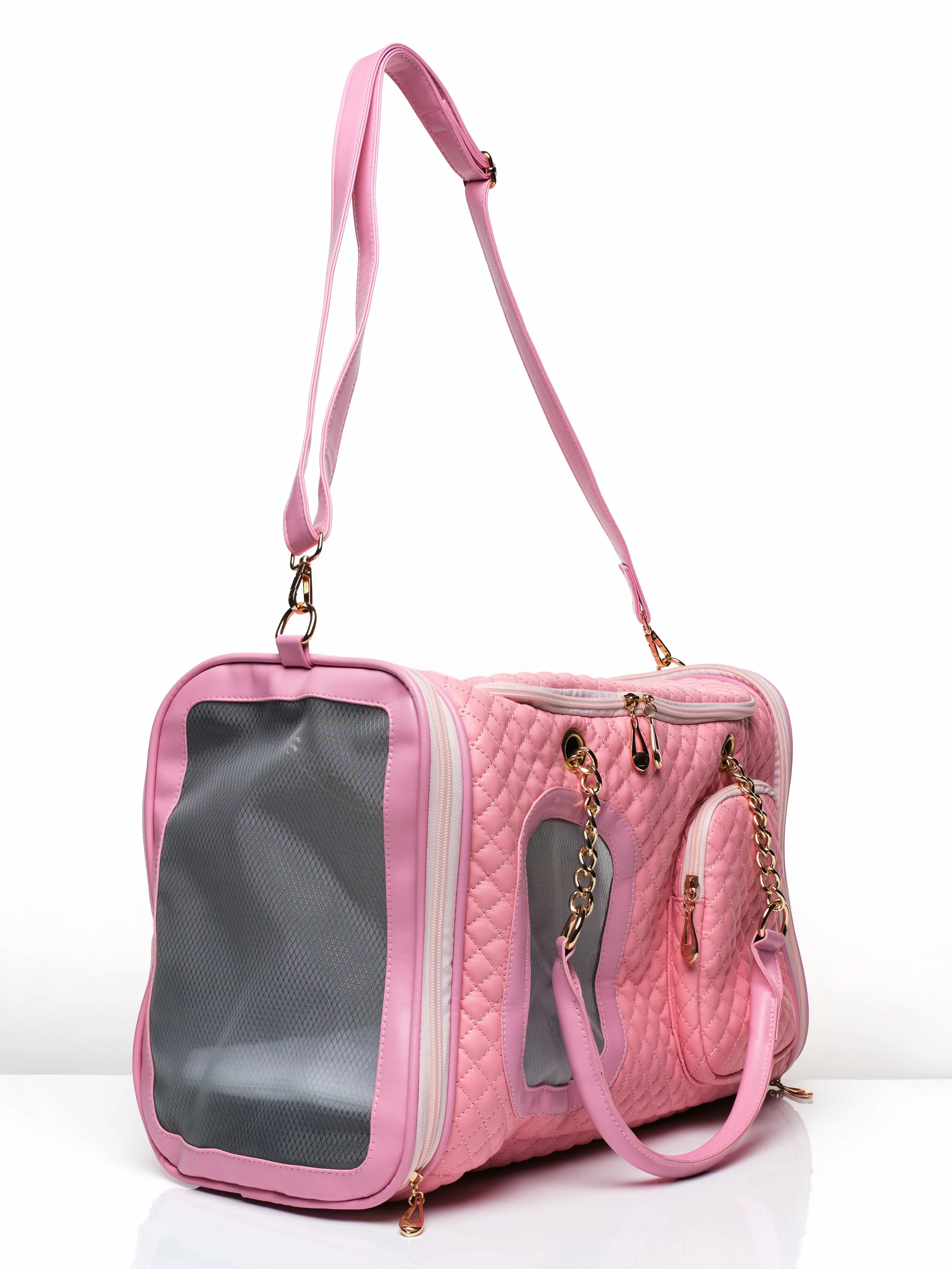 Left side angled view of the KibbleTime Pink Ambassadeur Tote pet carrier.
