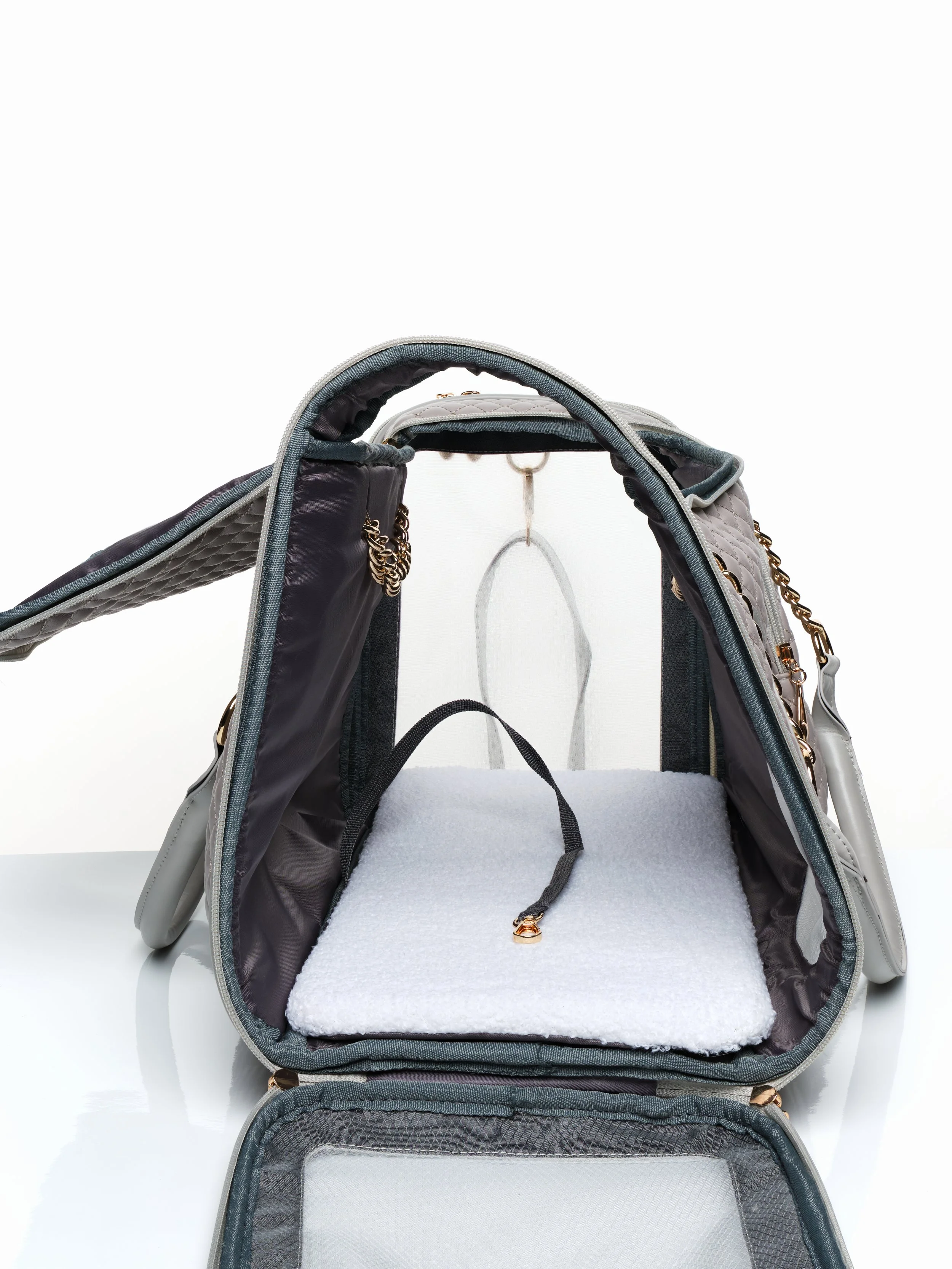 Side view looking into the KibbleTime Grey Ambassadeur Tote pet carrier with the top and side panel opened.