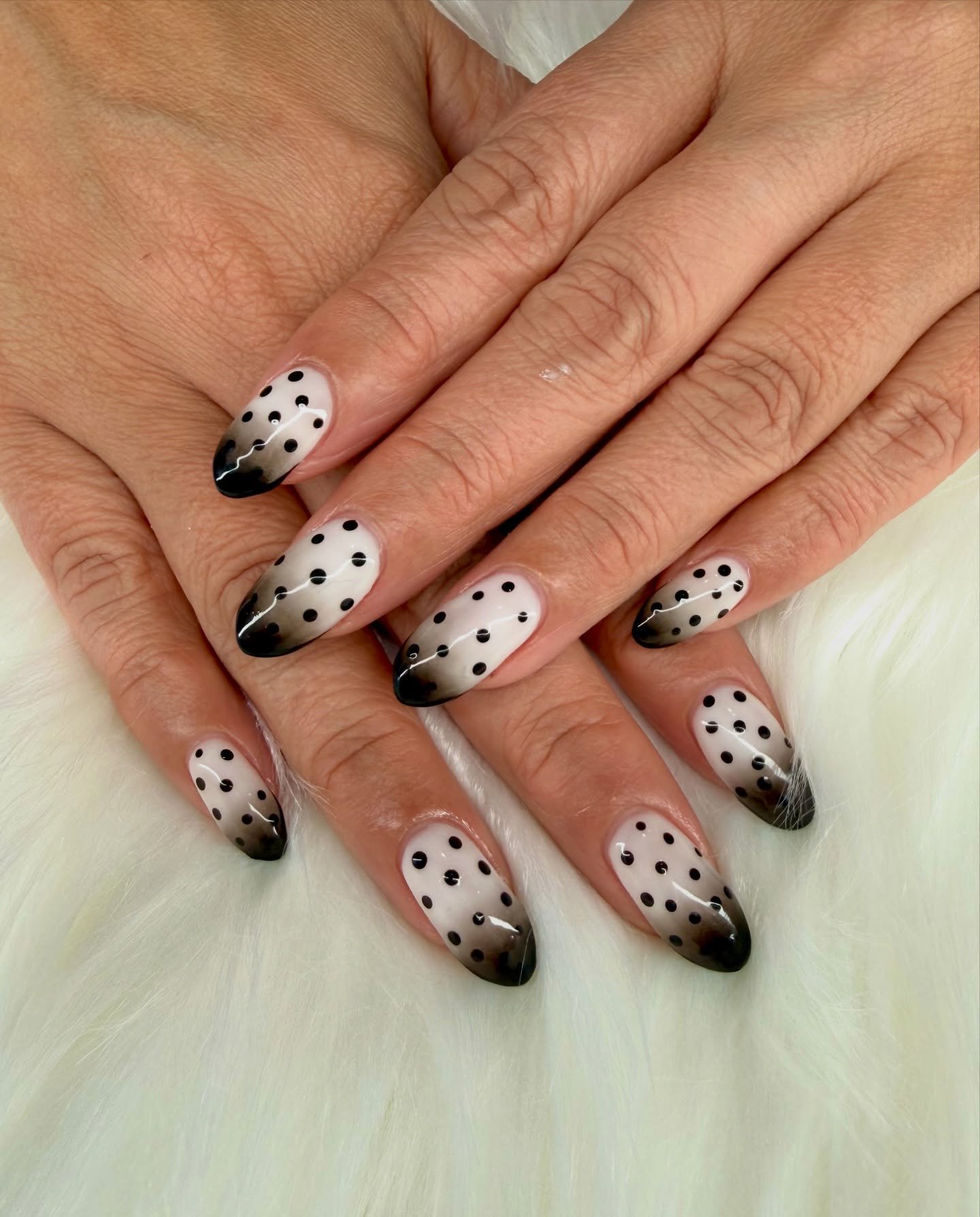 Black and White polka dots with ombre to bring in the new year💸🤍🖤 DM or click the link in our bio to book! 

#polishednailsmn #newyearnails #polkadotnails #ombrenails #blackandwhitenails