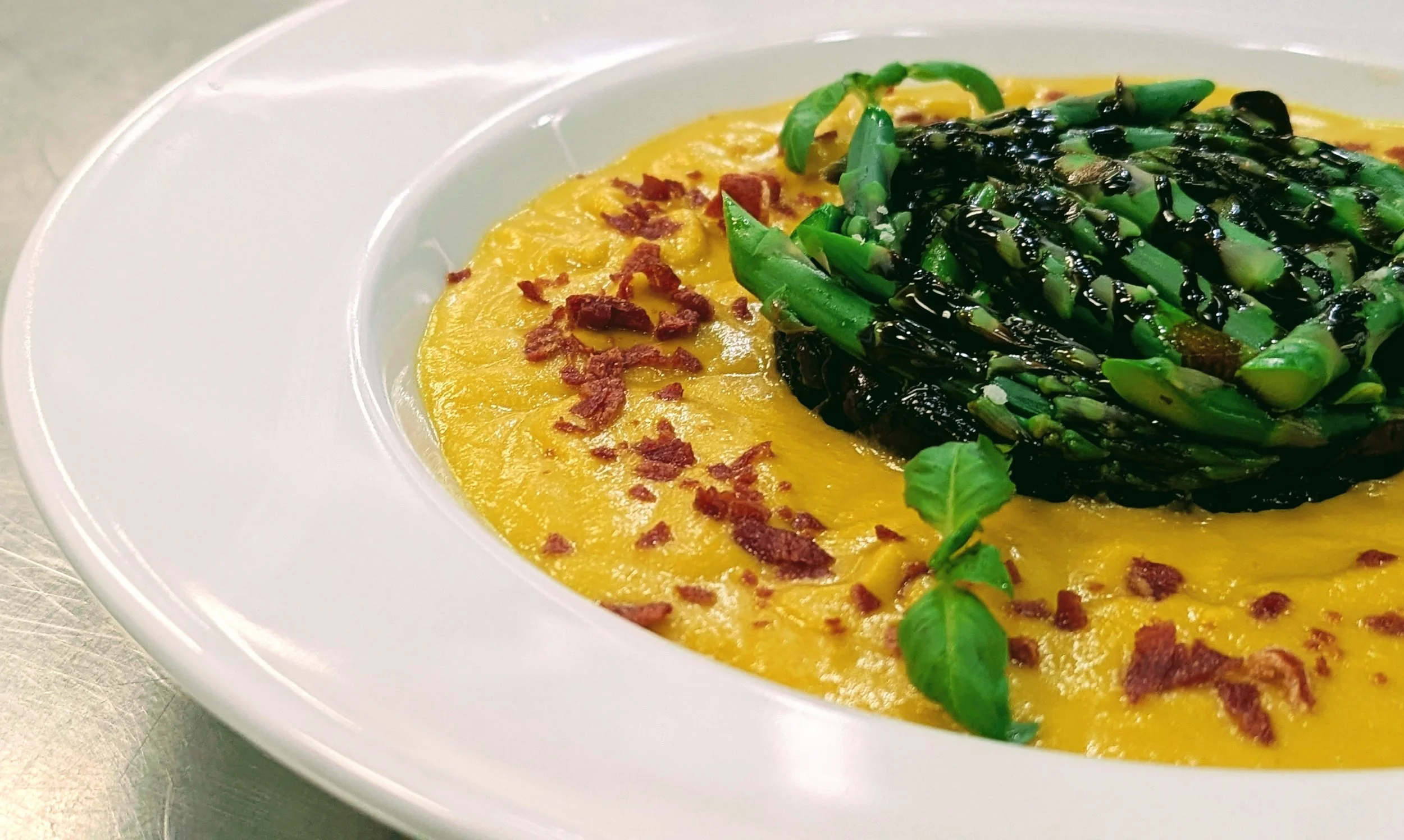 Icy Melon Mélange. Garden Breeze Bowl. Gazpacho. Simmered honeydew, cantaloupe melons, garlic, shallots, and vegetable stock, blended smooth luscious soup, chilled, then poured into an accoutrement of chilled asparagus, balsamic, crispy prosciutto