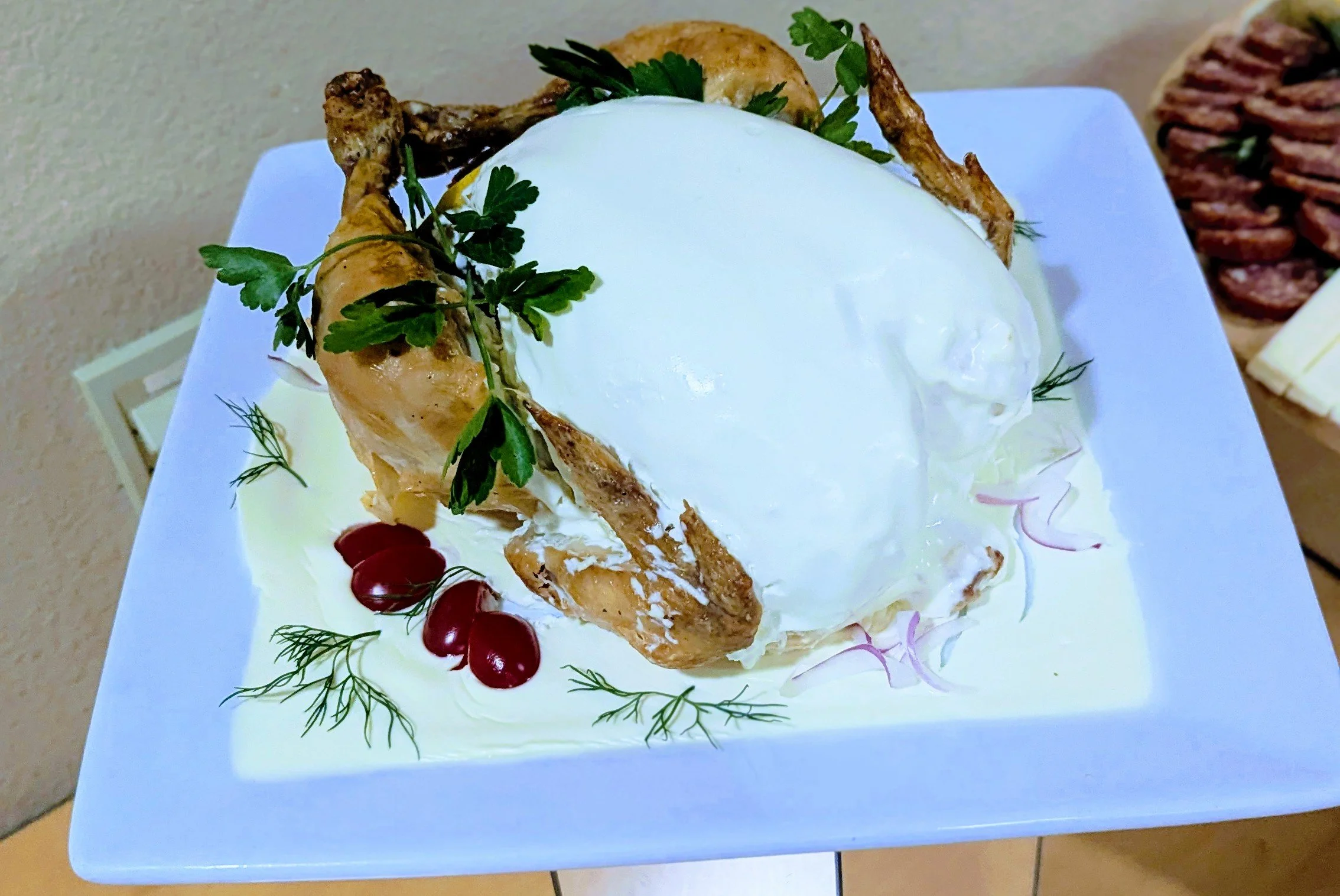Chicken Chaud-froid. sho-fwah. classic French dish of roasted, cooled chicken coated in a rich, aspic or white jellied sauce and garnished with cherry tomatoes, whole parsley and dill