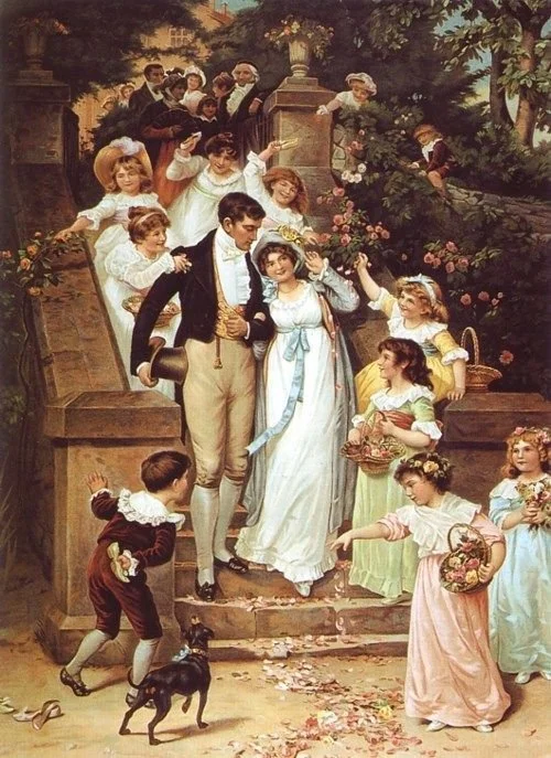 A group of well-dressed people, including children and adults, gather on and around a staircase in a garden, celebrating a special event or wedding, with some holding flowers and a dog nearby.
