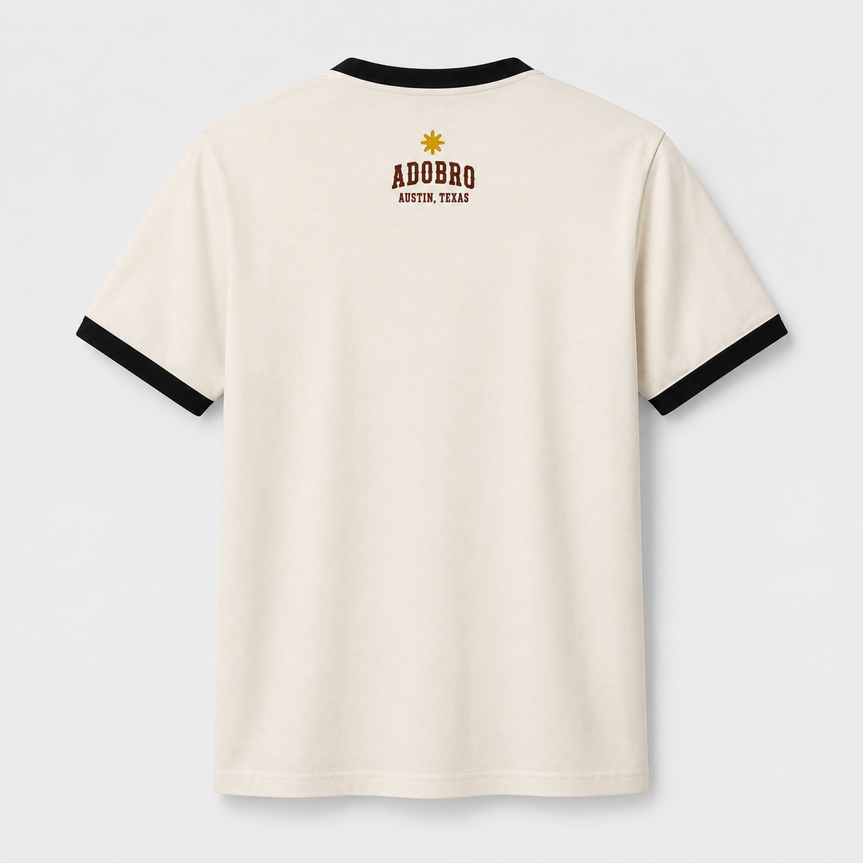 Back view of the MABUHOWDY™ Ringer Tee with a gold Filipino sun and ADOBRO Austin, Texas graphic.