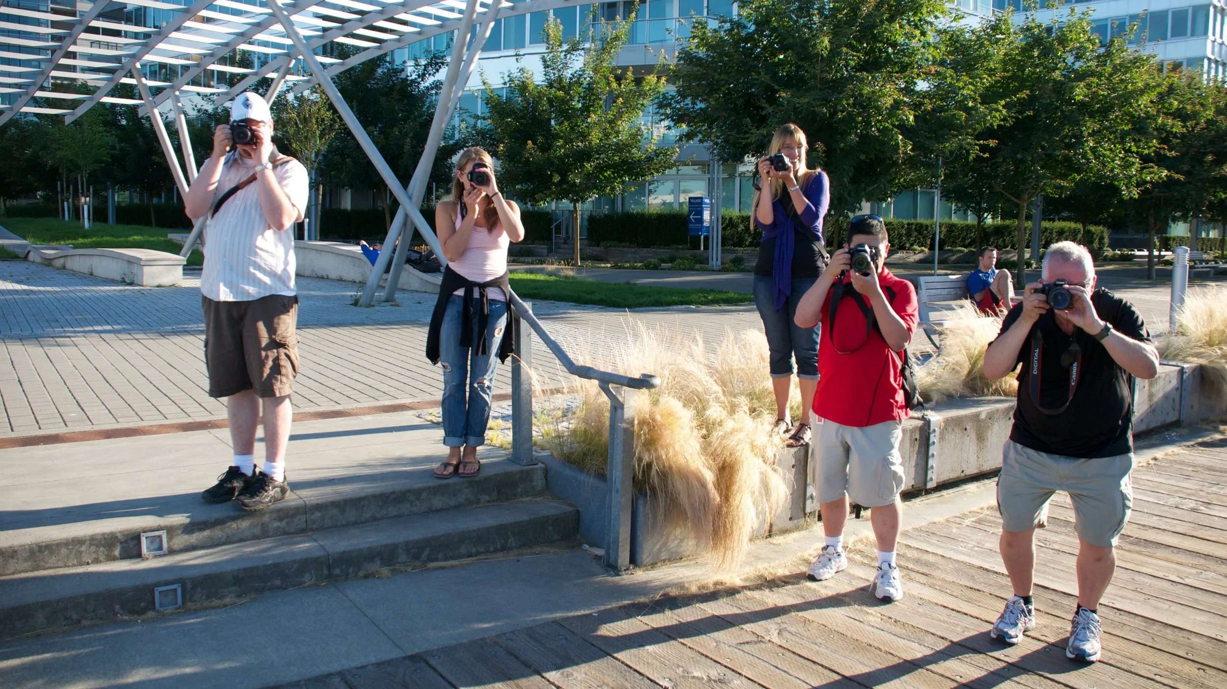 Student practicing photography at Vancouver waterfront during photo workshop