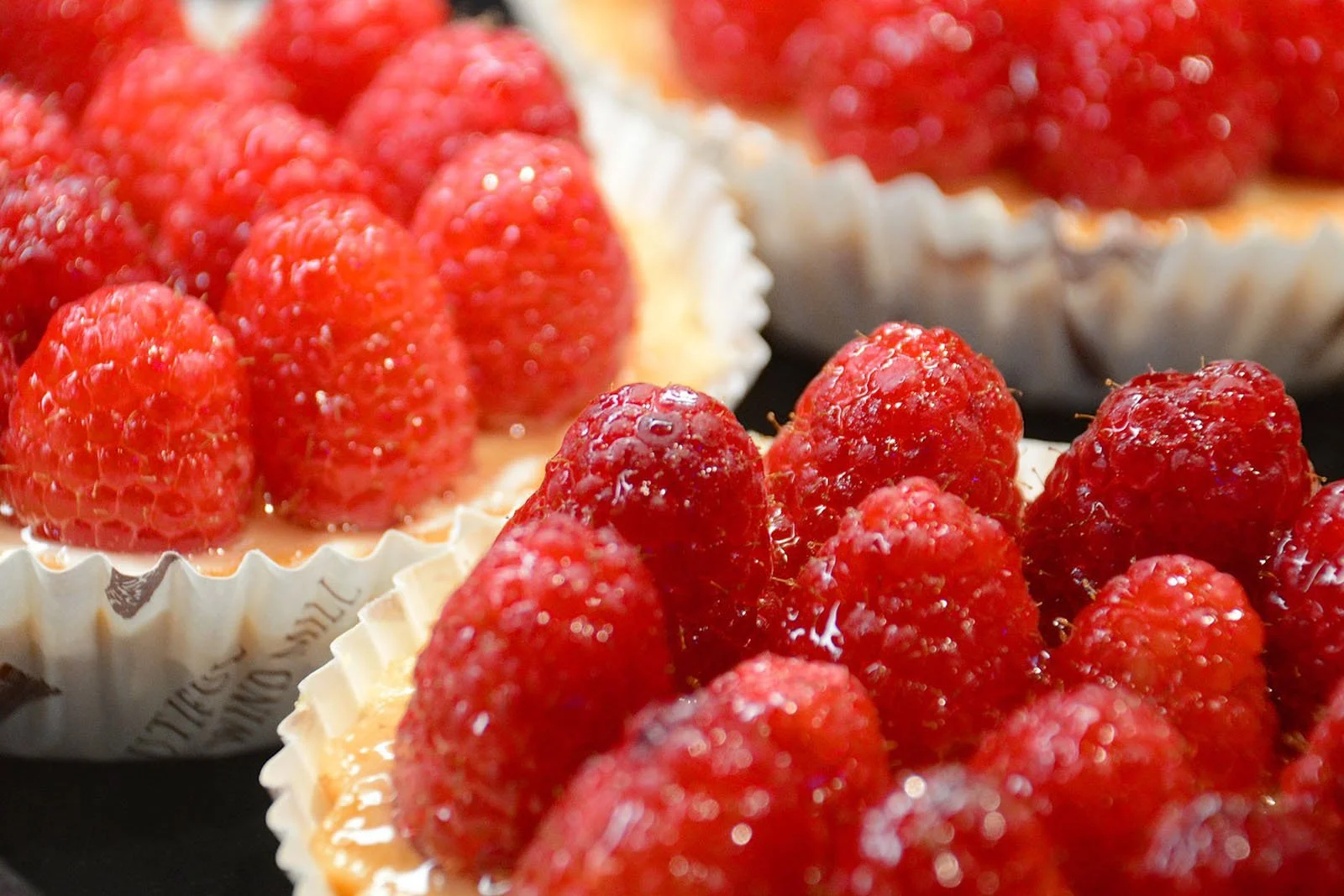 Food photography workshop with desserts topped with fresh raspberries